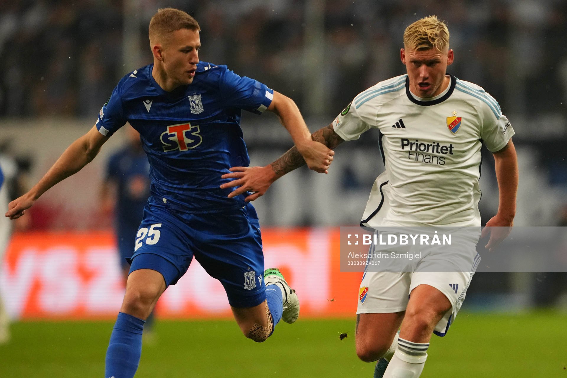 Filip Dagerstål of Lech Poznan and Victor Edvardsen of Djurgården during the UEFA Conference League round of 16 match between Lech Poznan and Djurgården on March 9, 2023 in Poznan.