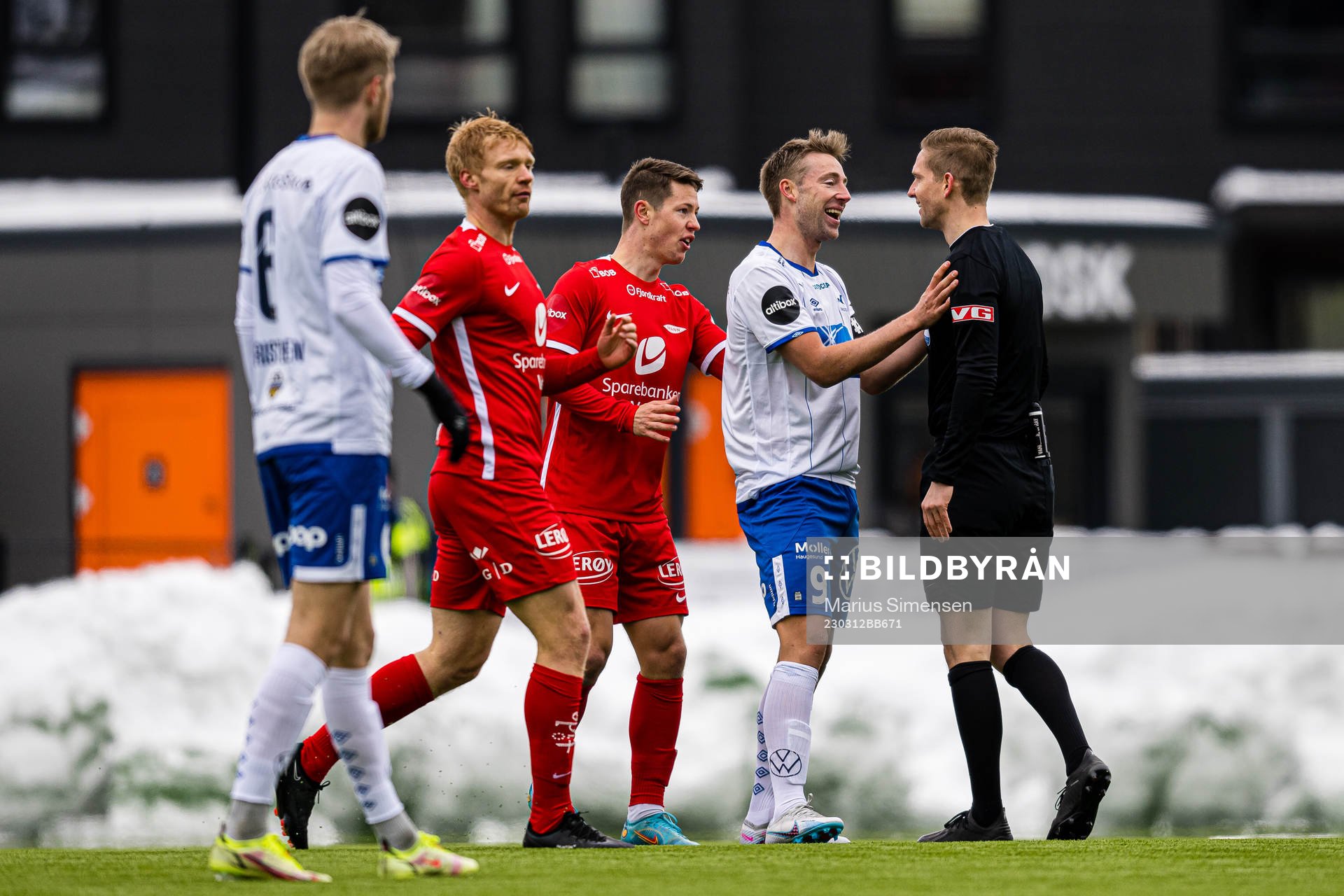 Sondre Liseth of Haugesund and Espen Andreas Eskås, referee