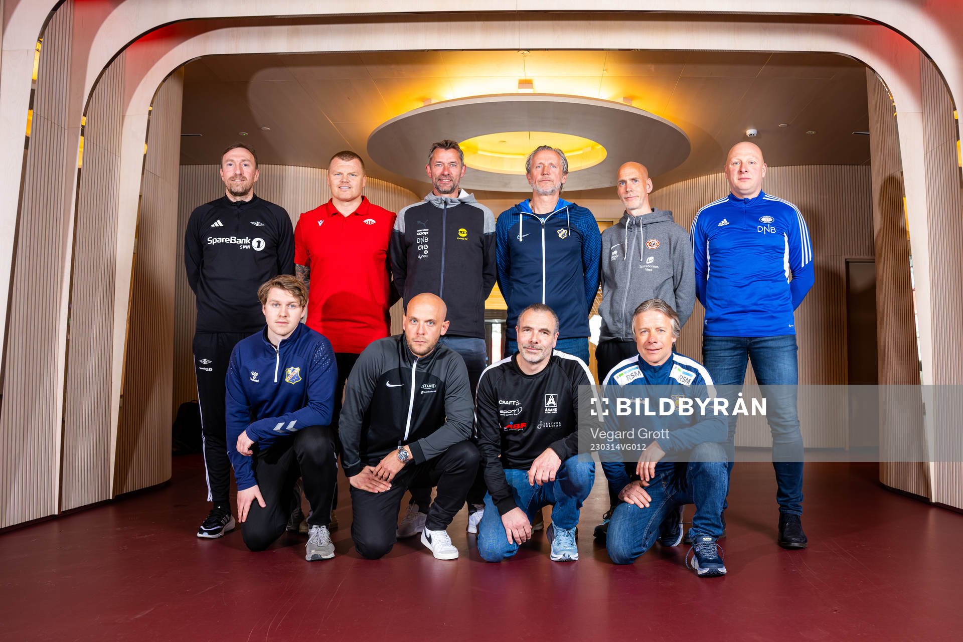 Head coaches pose for a team photo