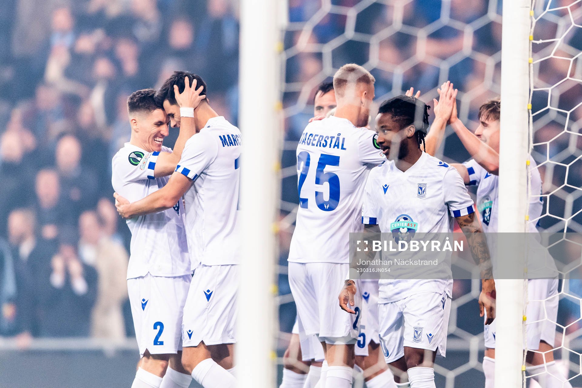 Filip Marchwinski of Lech Poznan celebrate with Joel Pereira