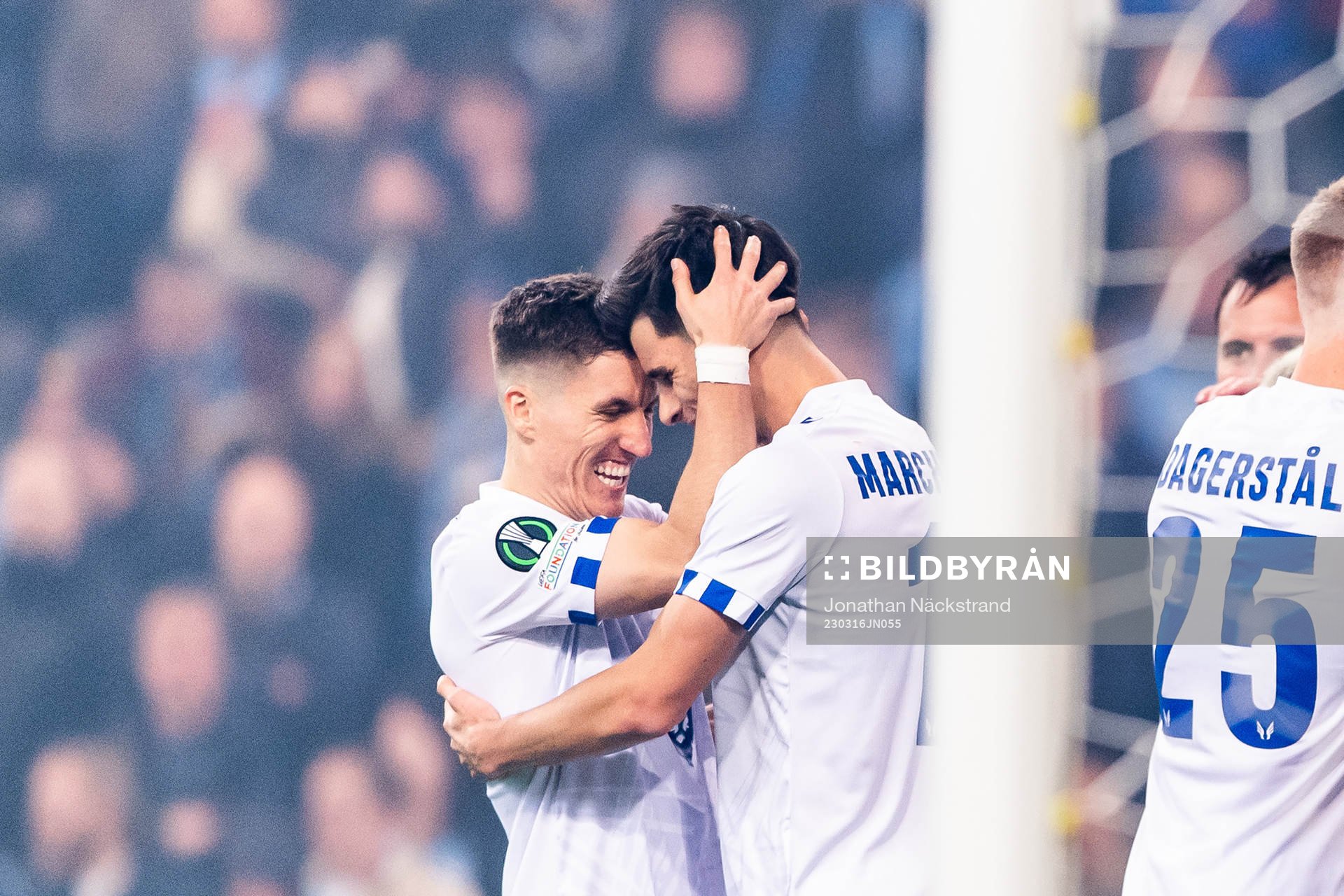 Filip Marchwinski of Lech Poznan celebrate with Joel Pereira after scoring the 0-1 goal during the UEFA Conference League round of 16 match between Djurgården and Lech Poznan on March 16, 2023 in Stockholm.