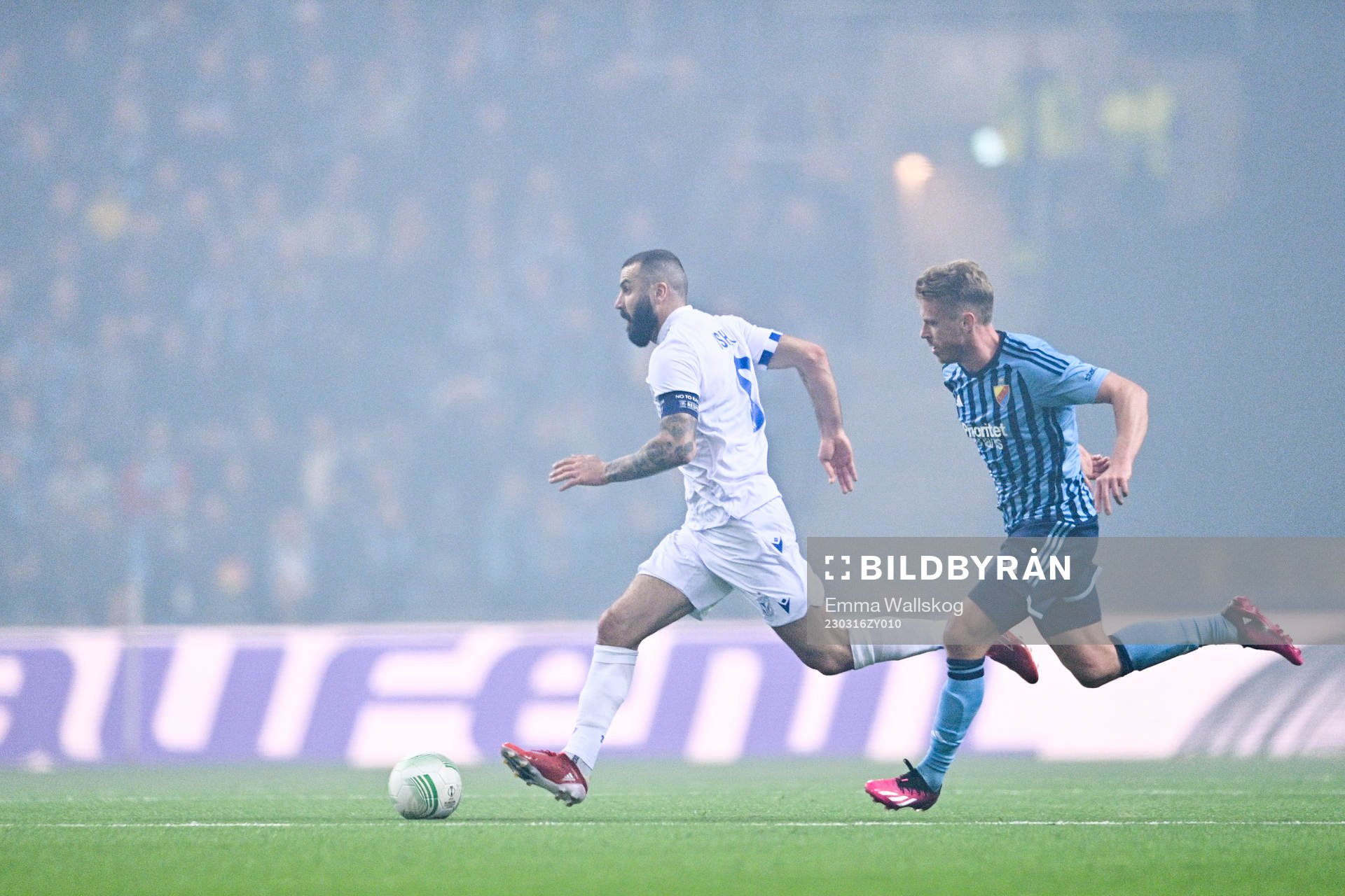 Mikael Ishak of Lech Poznan and Rasmus Schuller of