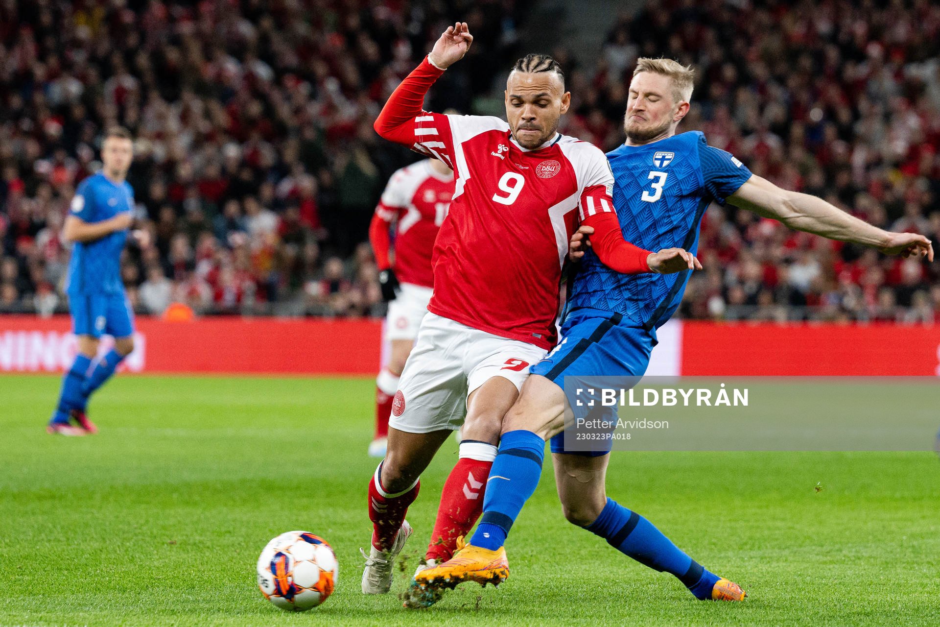 Martin Braithwaite of Denmark and Richard Jensen of Finland
