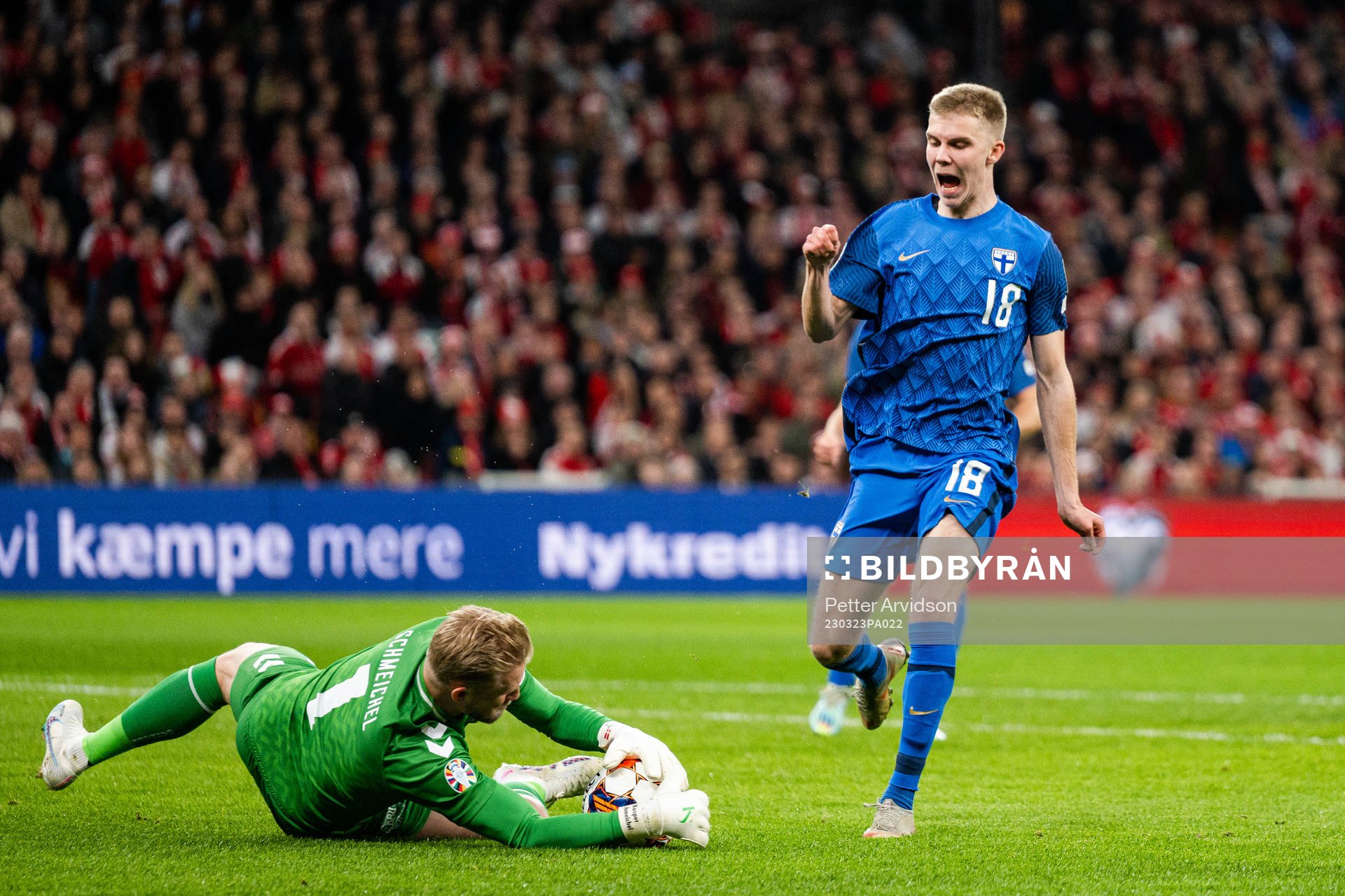 Oliver Antman of Finland against goalkeeper Kasper