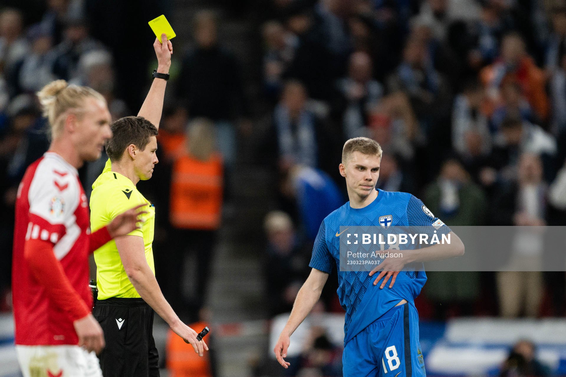 Oliver Antman of Finland receives a yellow card