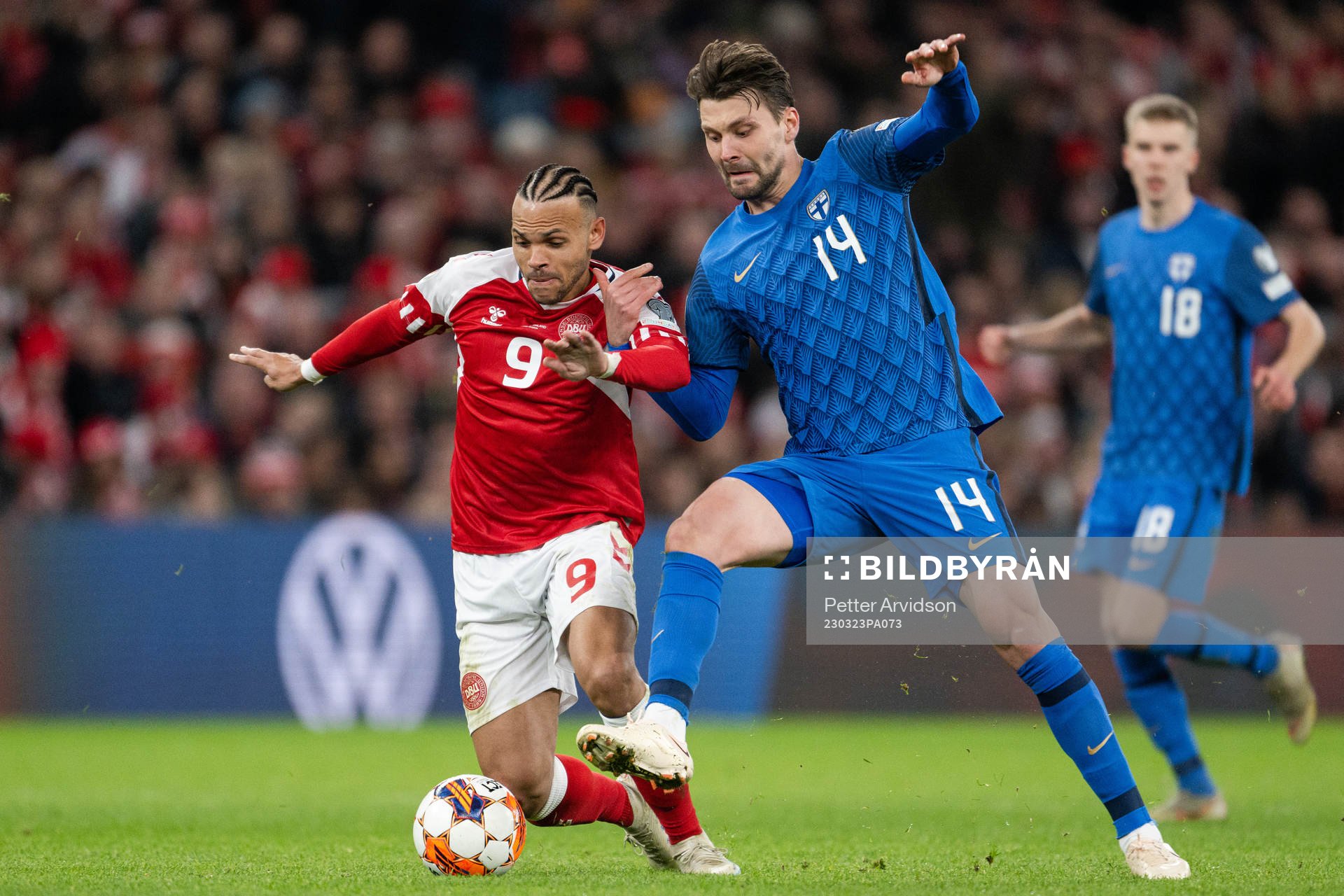 Martin Braithwaite of Denmark and Kaan Kairinen of Finland