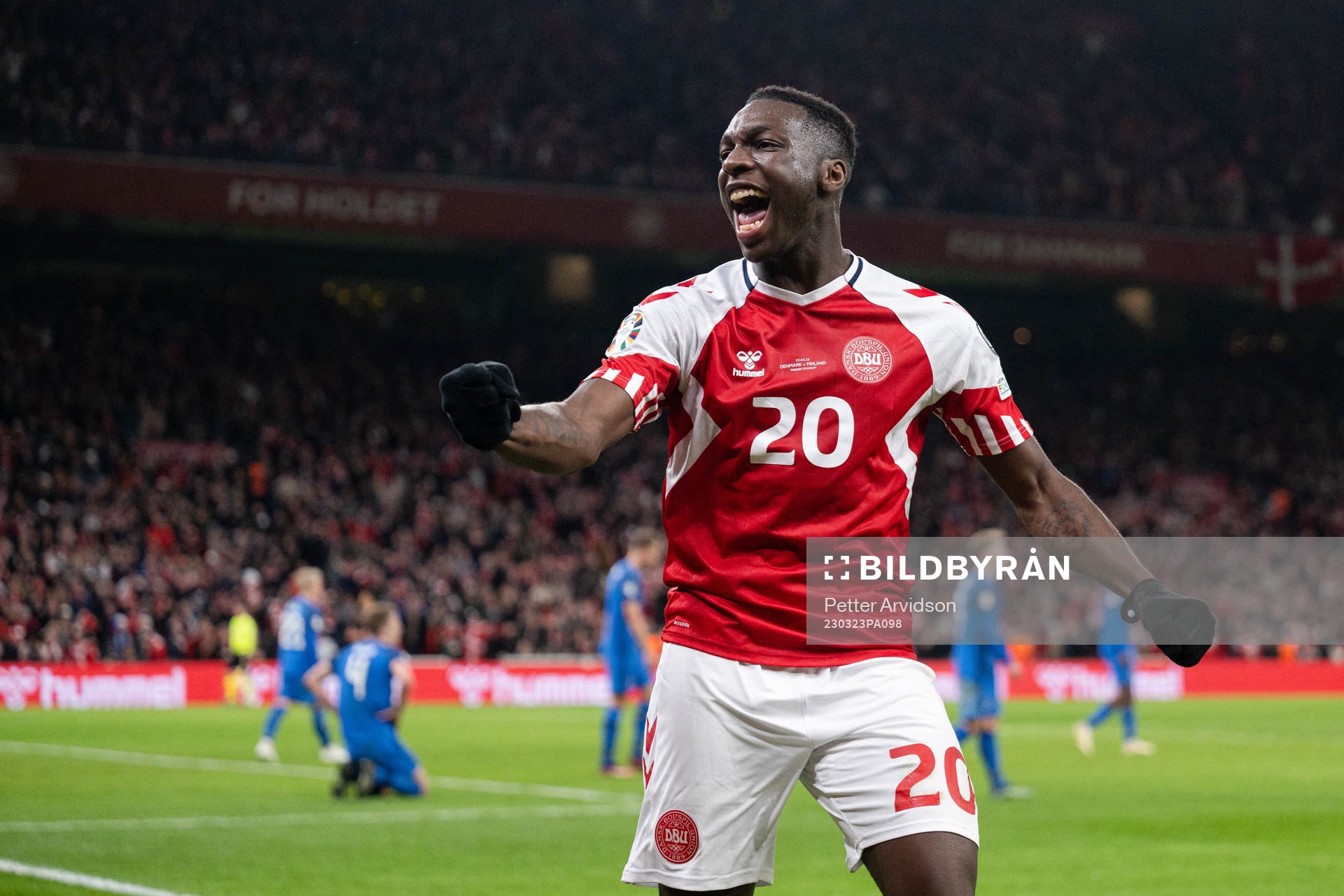 Mohamed Daramy of Denmark celebrate the 3-1 goal by Rasmus Højlund, not pictured, during the UEFA Euro Qualifier football match between Denmark and Finland on March 23, 2023 in Copenhagen.