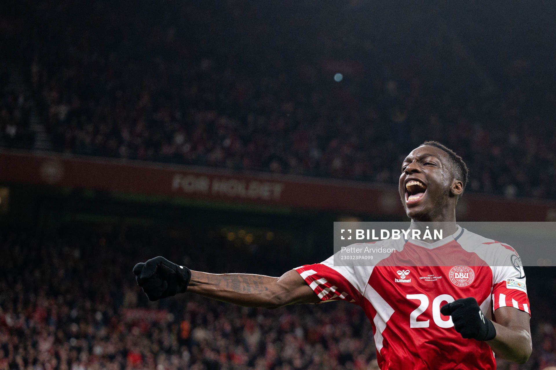 Mohamed Daramy of Denmark celebrate the 3-1 goal by Rasmus Højlund, not pictured, during the UEFA Euro Qualifier football match between Denmark and Finland on March 23, 2023 in Copenhagen.