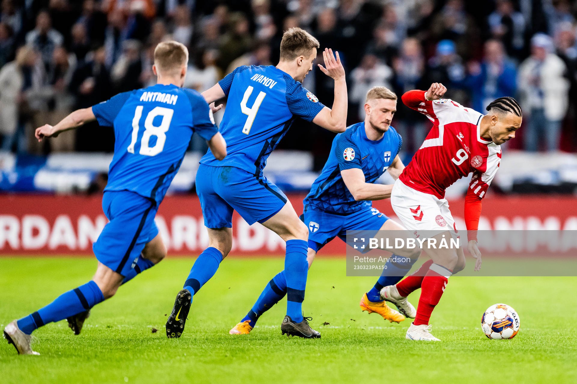 Martin Braithwaite of Denmark against Oliver Antman, Robert Ivanov and Richard Jensen during the UEFA Euro Qualifier football match between Denmark and Finland on March 23, 2023 in Copenhagen.