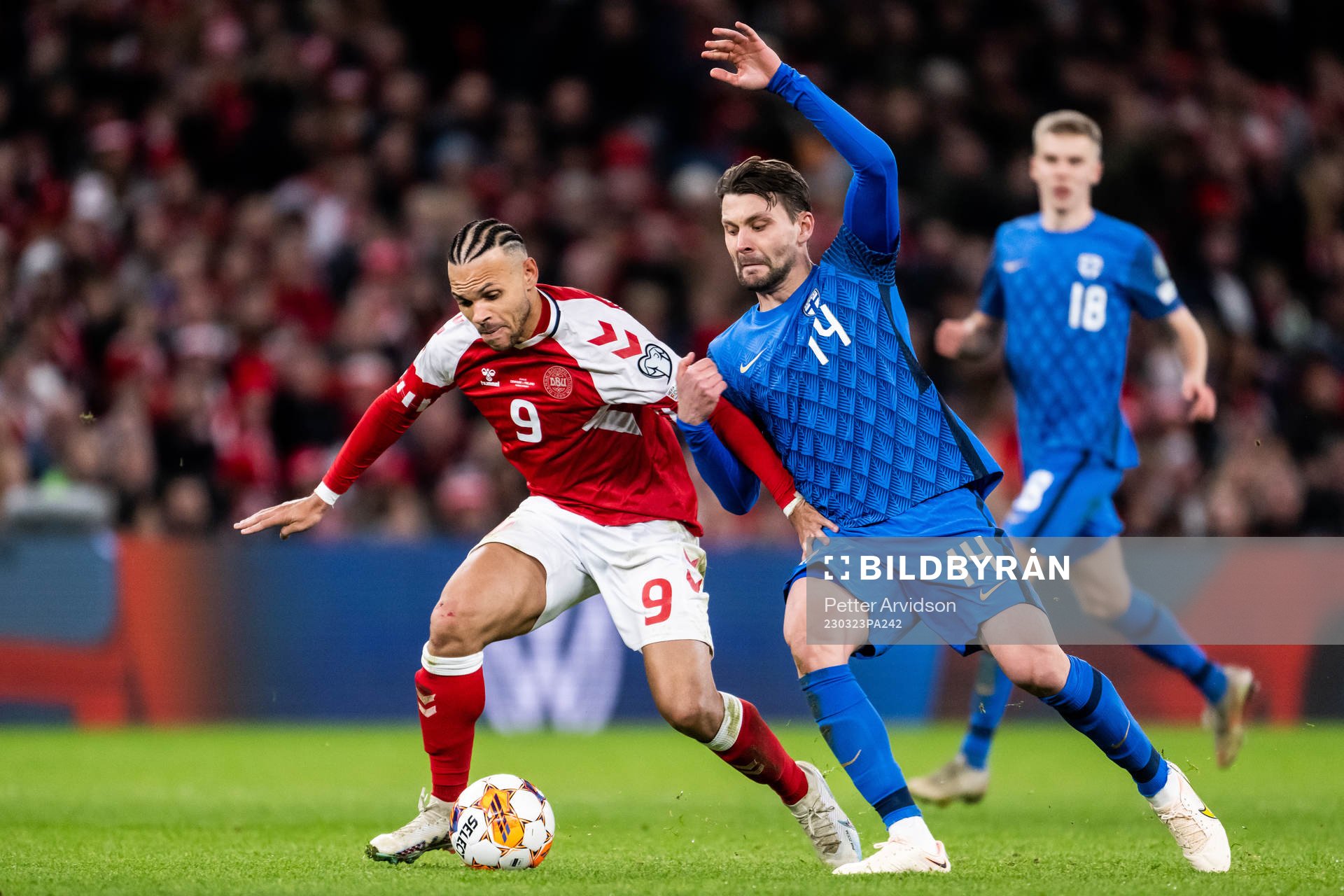 Martin Braithwaite of Denmark and Kaan Kairinen of Finland