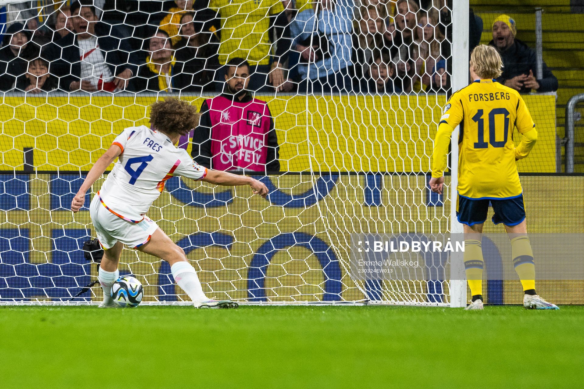 Wout Faes of Belgium saves the ball