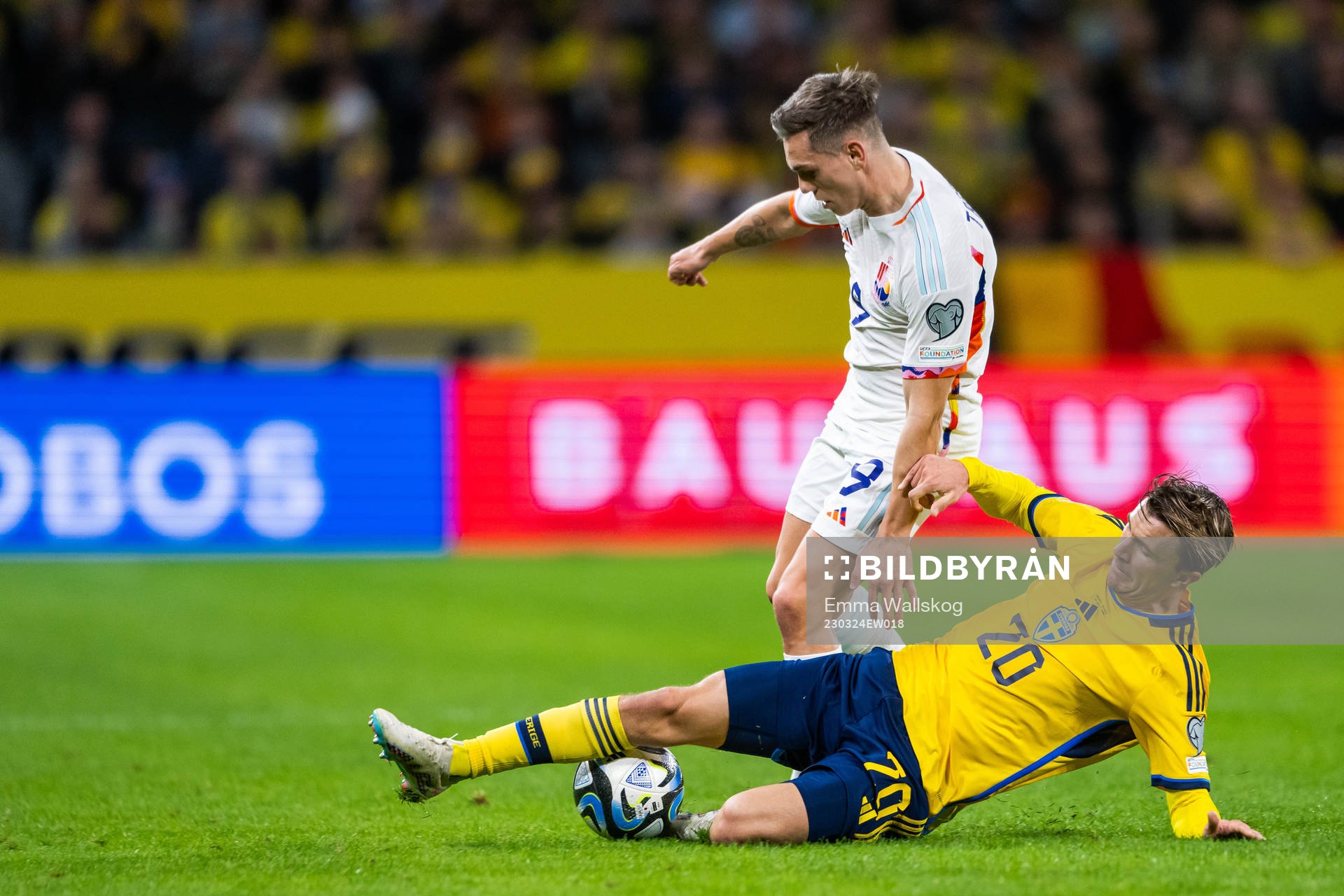 Leandro Trossard of Belgium and Kristoffer Olsson of Sweden