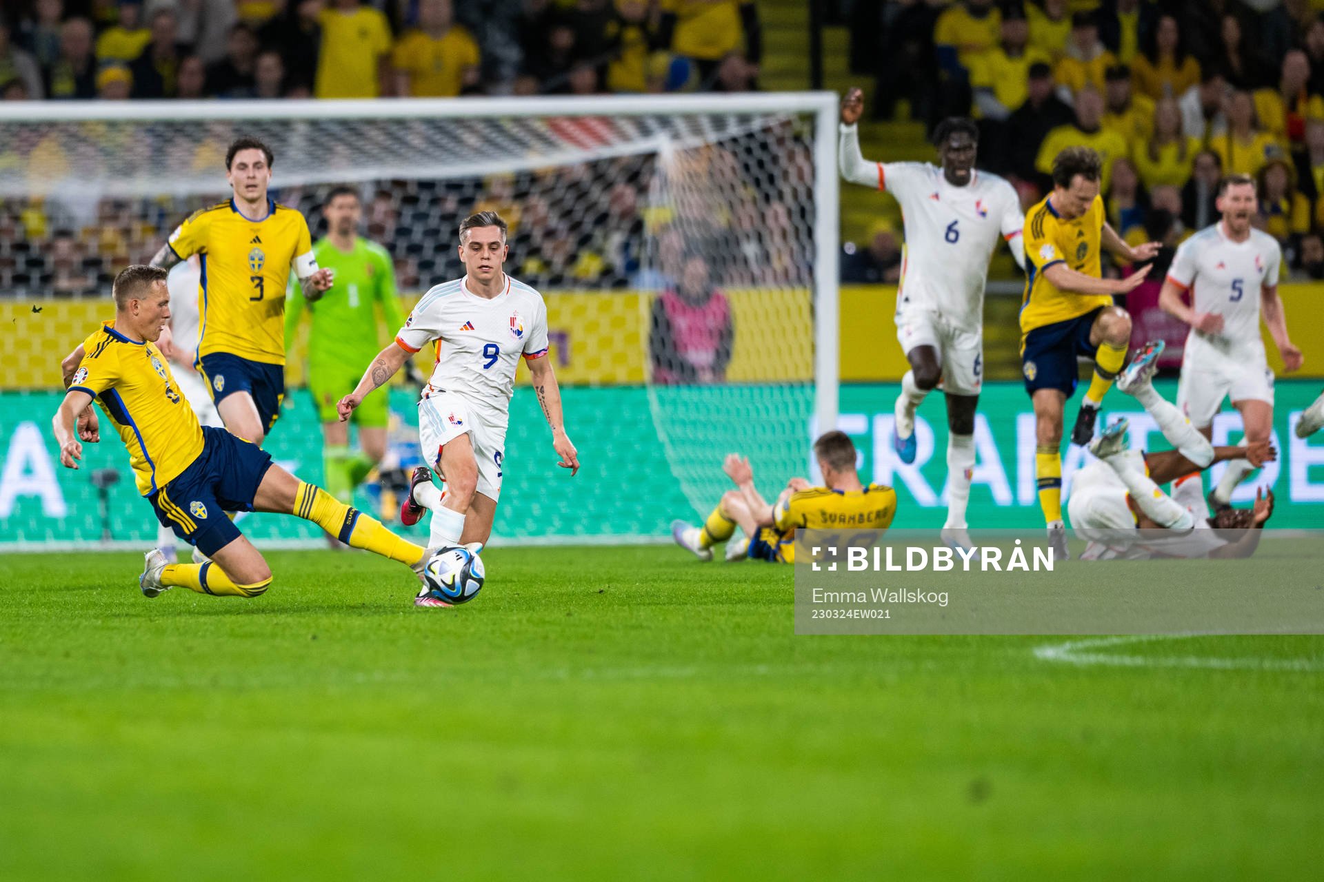 Ludvig Augustinsson of Sweden and Leandro Trossard of