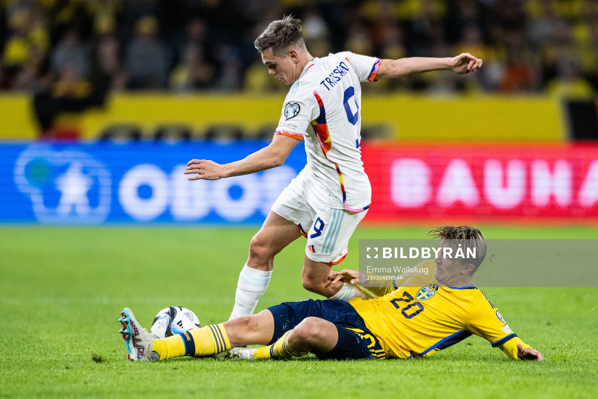 Leandro Trossard of Belgium and Kristoffer Olsson of Sweden