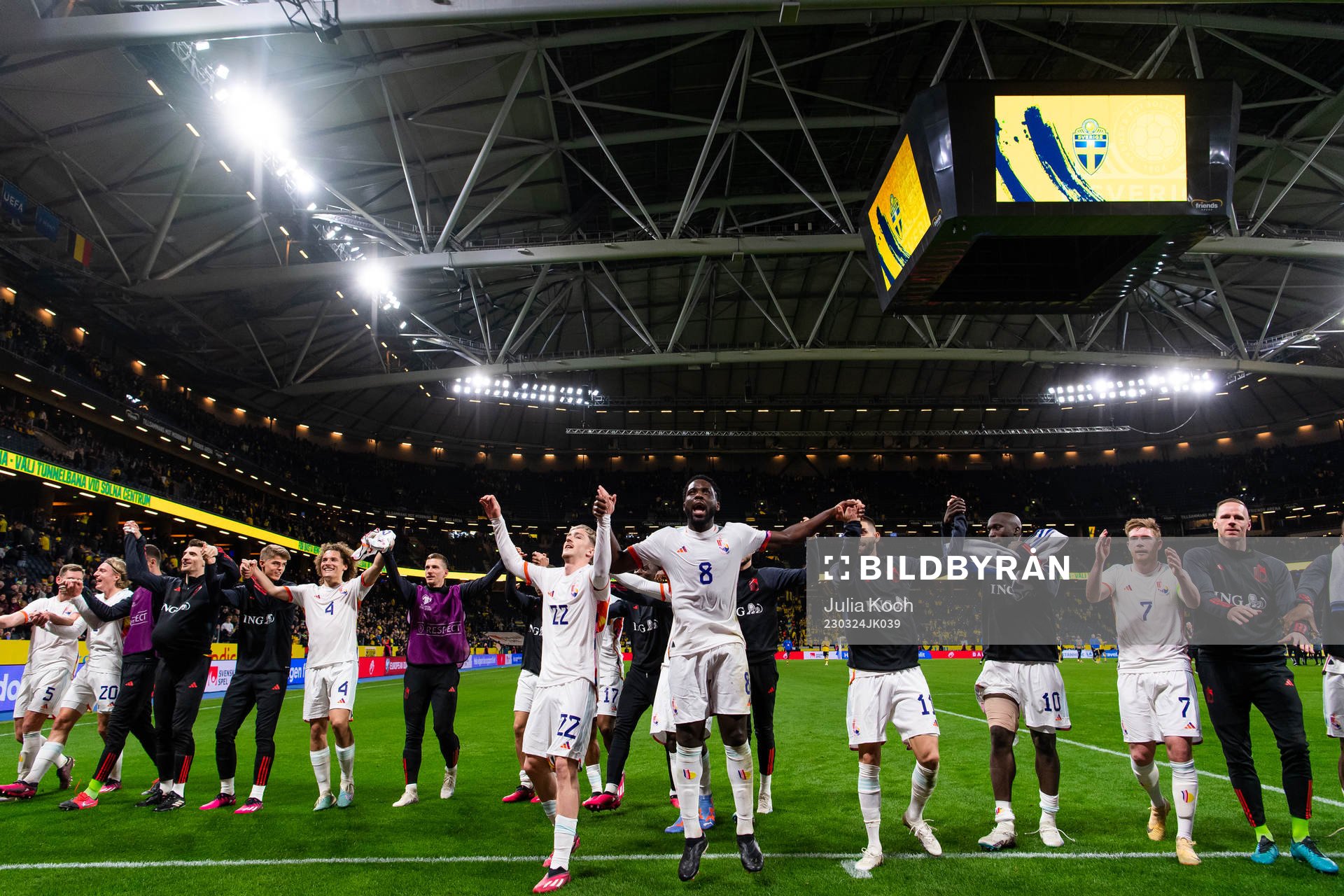Alexis Saelemaekers and Orel Mangala of Belgium celebrate with team mates after the UEFA Euro Qualifier football match between Sweden and Belgium on March 24, 2023 in Stockholm.