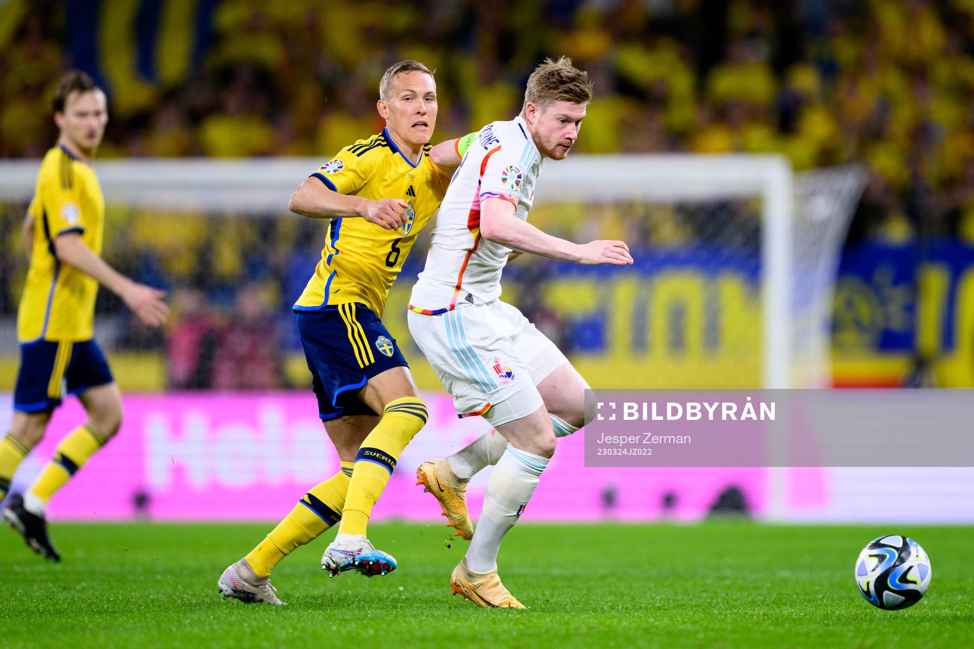 Ludvig Augustinsson of Sweden and Kevin de Bruyne of Belgium