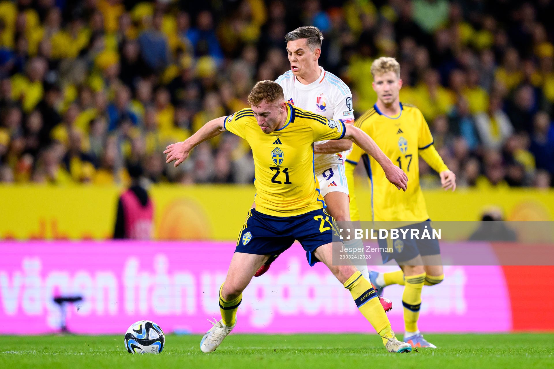 Dejan Kulusevski of Sweden and Leandro Trossard of Belgium