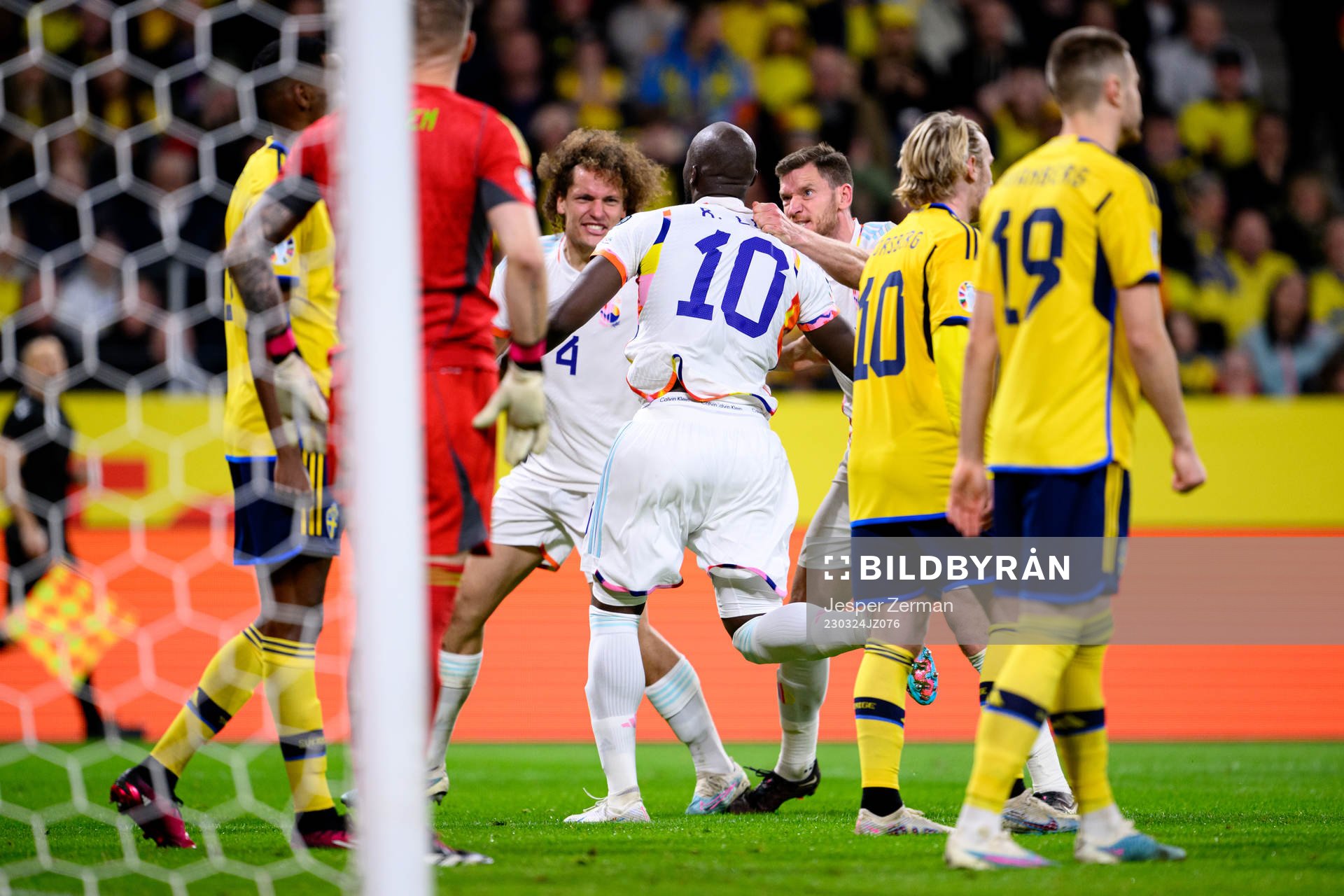 Romelu Lukaku of Belgium celebrates with Wout Faes and Jan