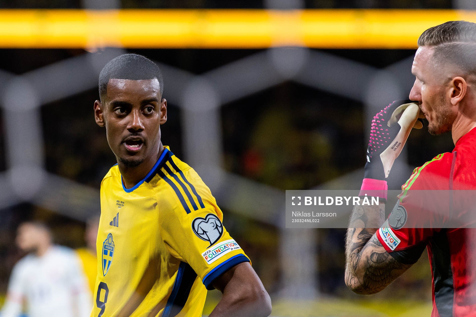Alexander Isak and goalkeeper Robin Olsen of Sweden