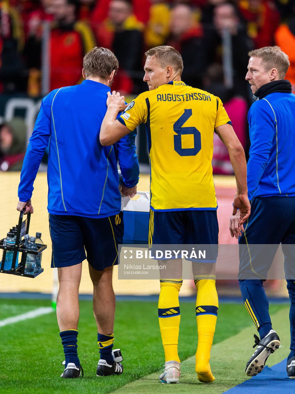 Ludvig Augustinsson of Sweden leaves the pitch due to injury