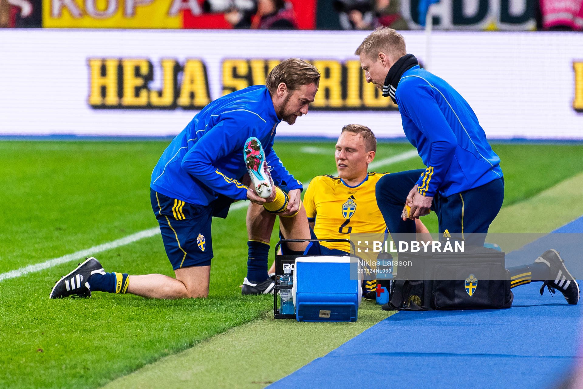 Ludvig Augustinsson of Sweden leaves the pitch and receives