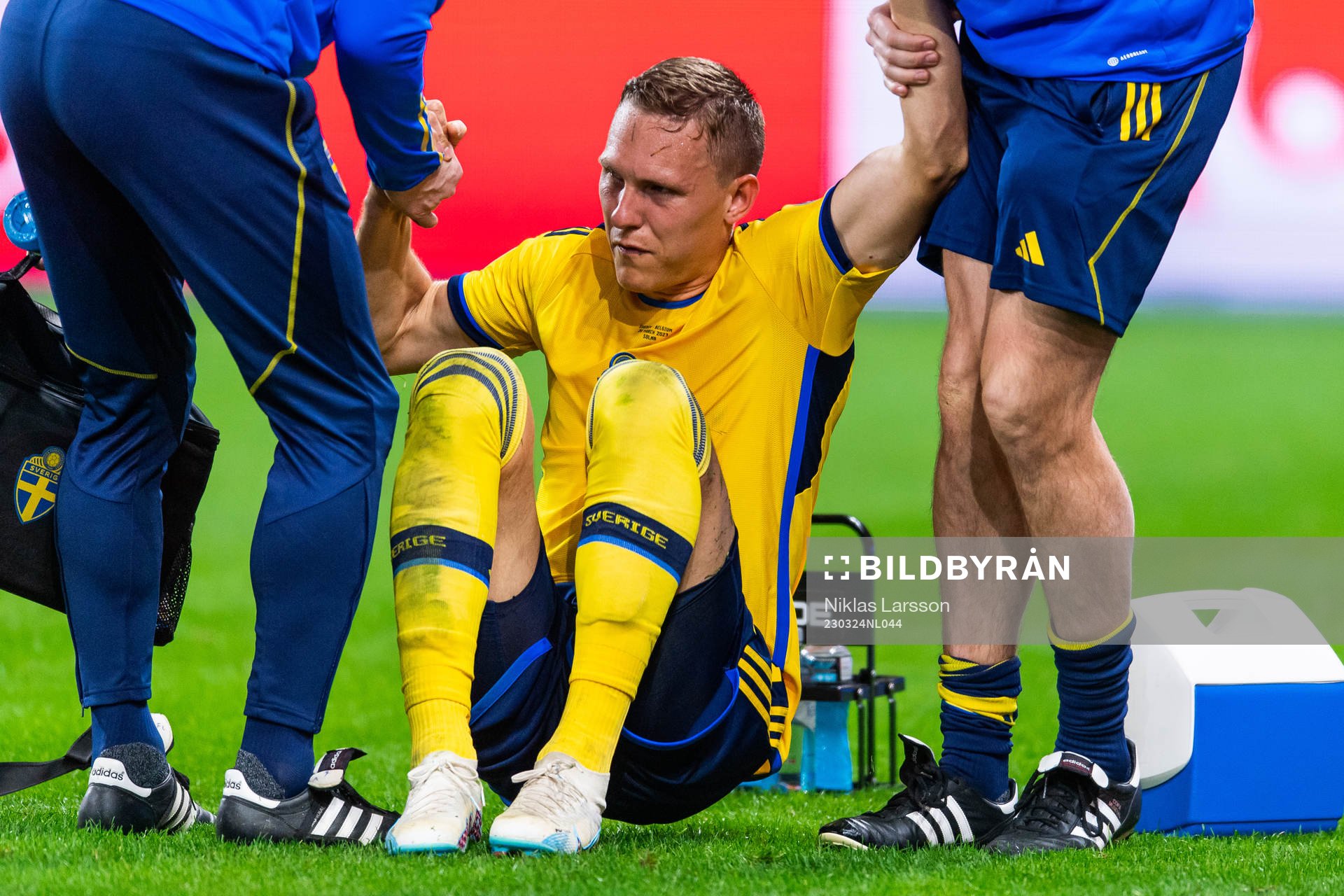 Ludvig Augustinsson of Sweden leaves the pitch due to injury