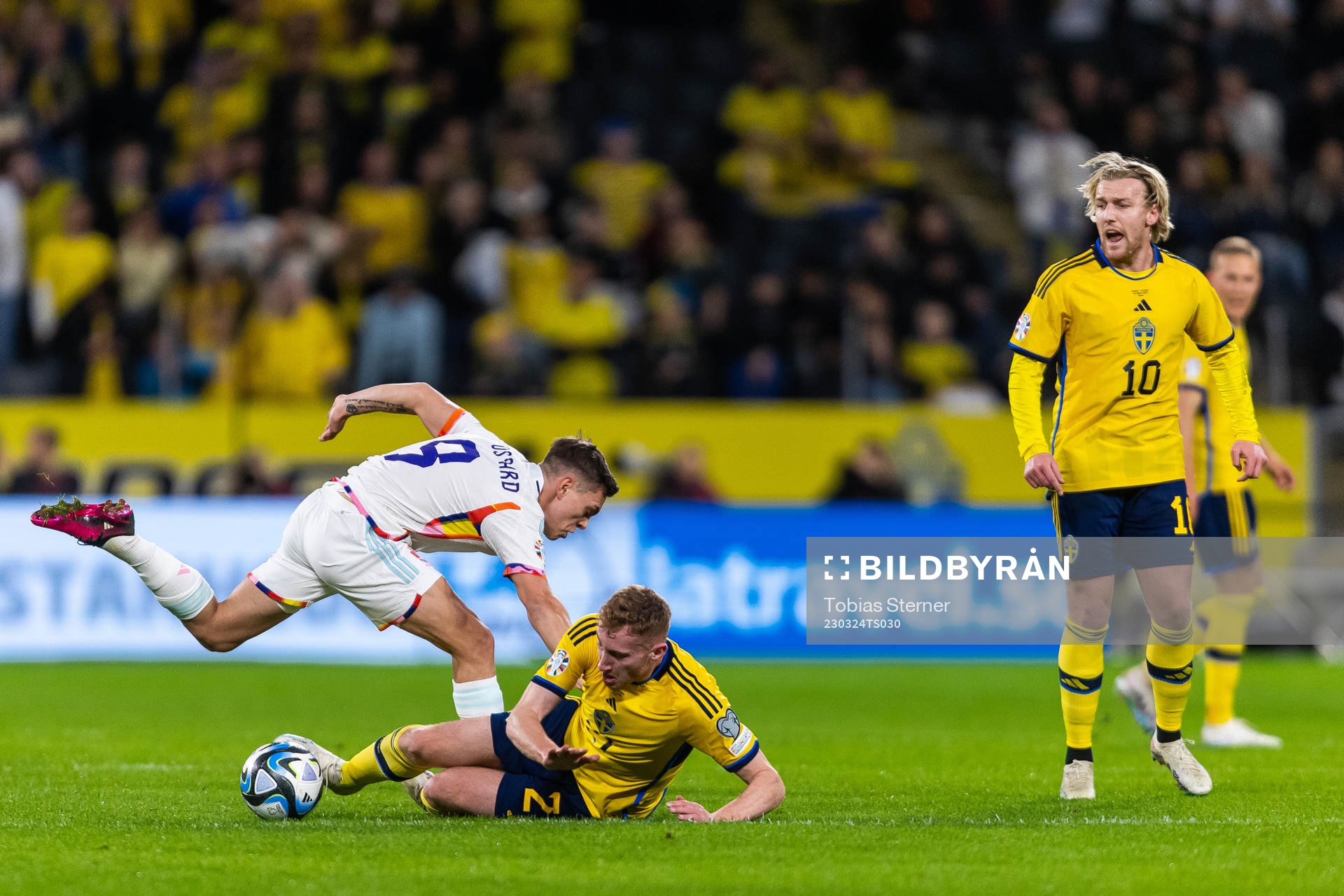 Leandro Trossard of Belgium competes for the ball with