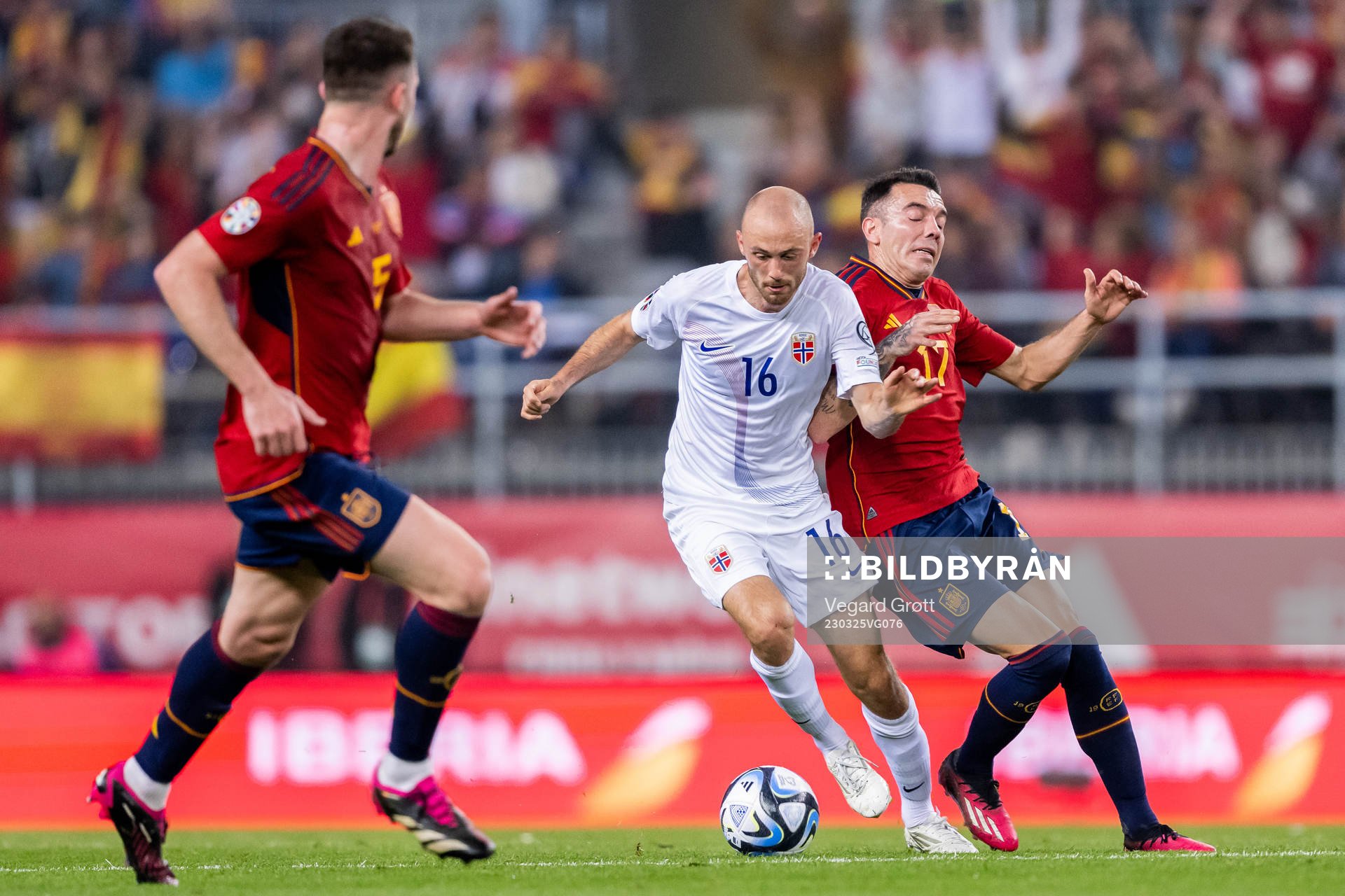 Fredrik Aursnes of Norway and Iago Aspas of Spain