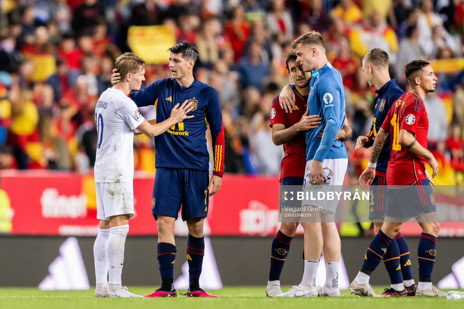 Martin Ødegaard of Norway and Álvaro Morata of Spain