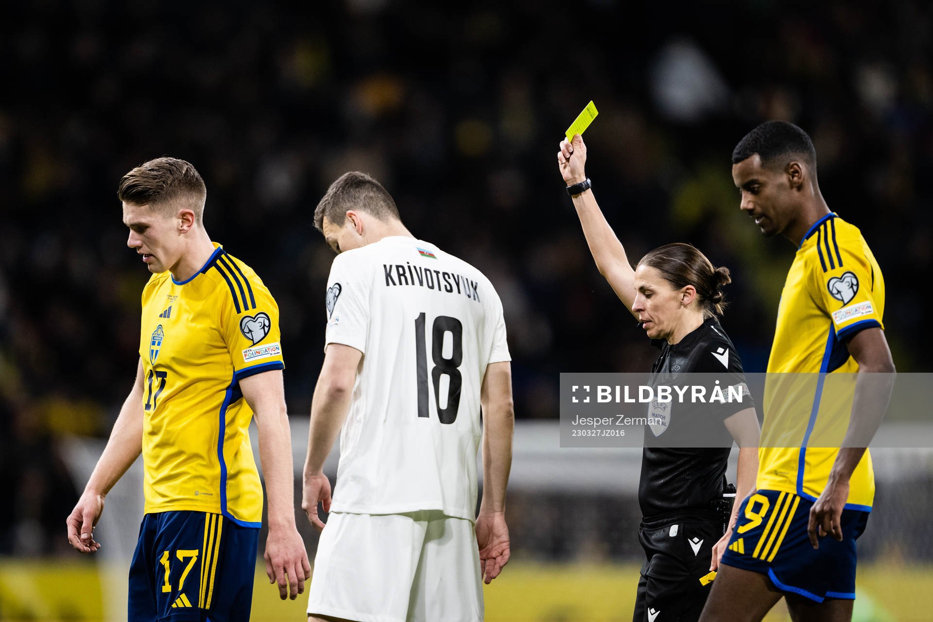 Viktor Gyökeres of Sweden receives a yellow card by