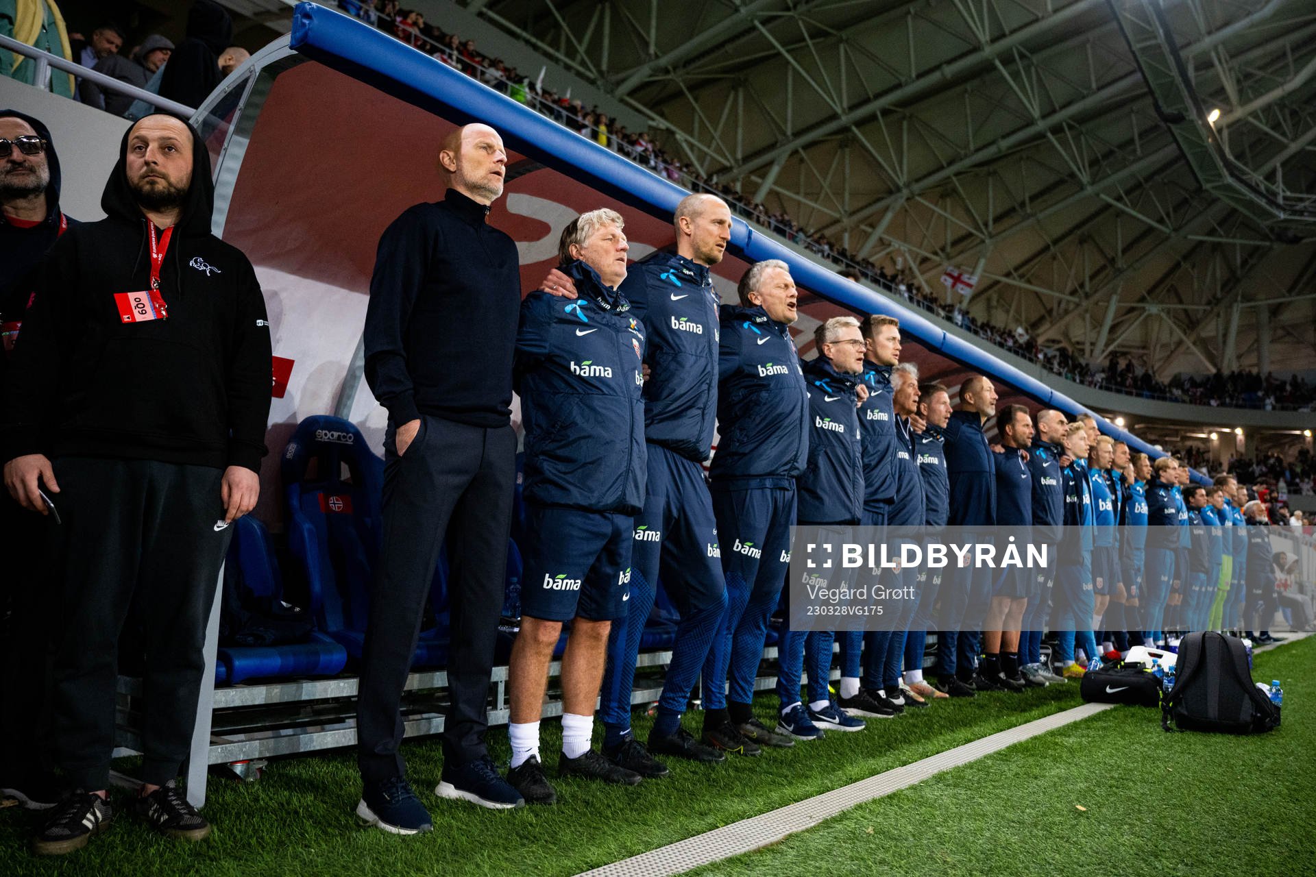 Ståle Solbakken, head coach of Norway, and his staff ahead of the UEFA Euro Qualifier football match between Georgia and Norway on March 28, 2023 in Batumi. From left: Kent Bergersen, assistant coach, Brede Hangeland, player manager, Frode Grodås, goalkeeper coach, Are Hokstad, team manager, Pål Fjelde, tactical statistician, Ola Sand, doctor, Bjørn Vidar Stenersen, fitness coach, Leif Arne Lystad, manual therapist, Thomas Ødegaard, manual therapist, and Sigurd Ertsås, kit manager.