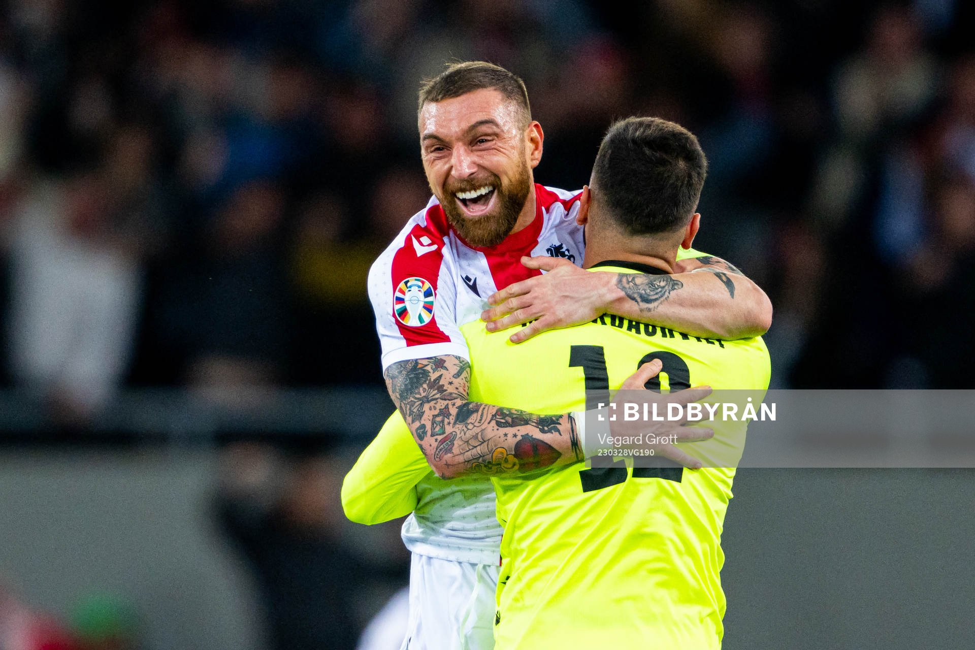 Goalkeeper Giorgi Mamardashvili and Guram Kashia of Georgia celebrate after 1-1 during the UEFA Euro Qualifier football match between Georgia and Norway on March 28, 2023 in Batumi.