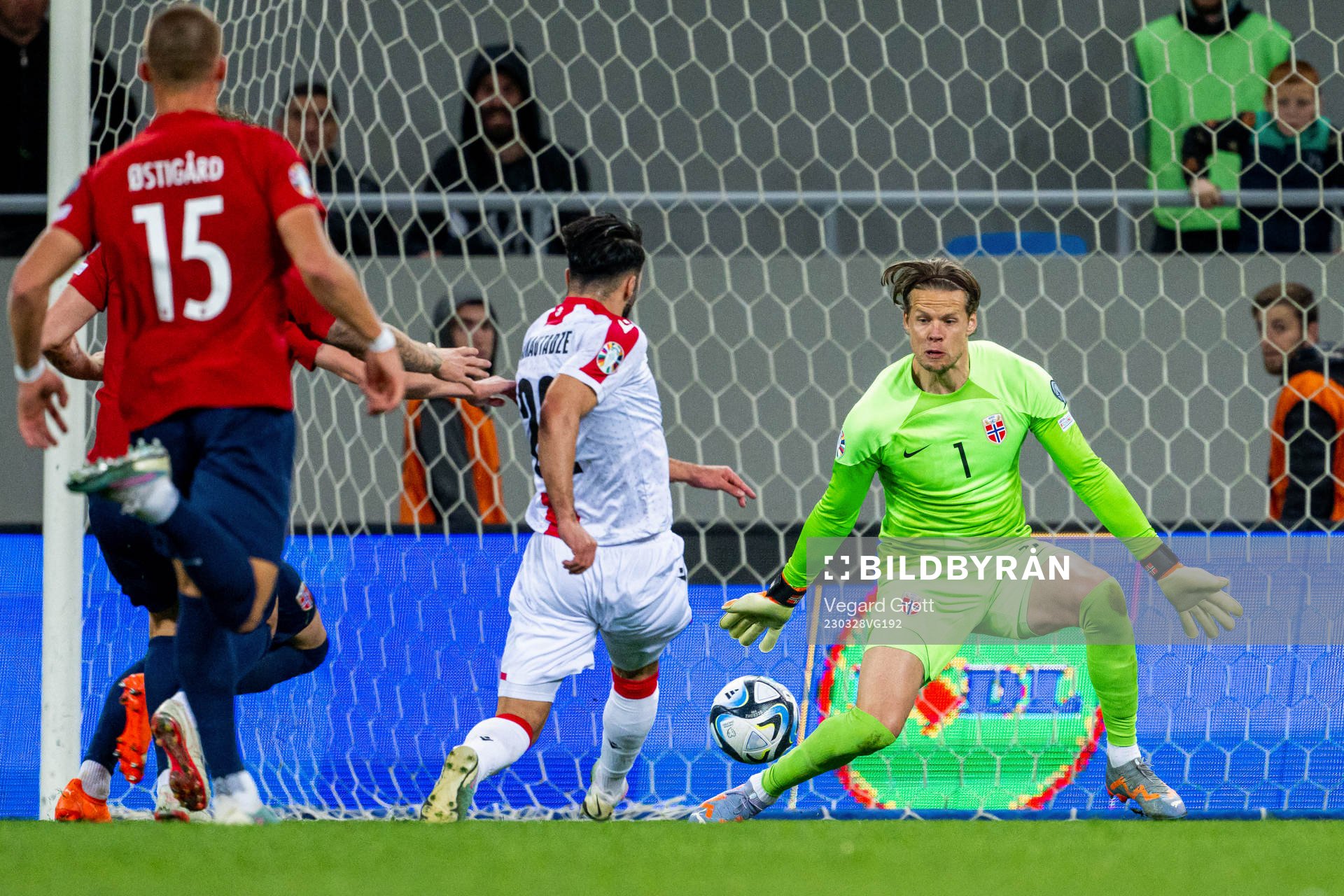 Georges Mikautadze of Georgia scores 1-1 behind goalkeeper