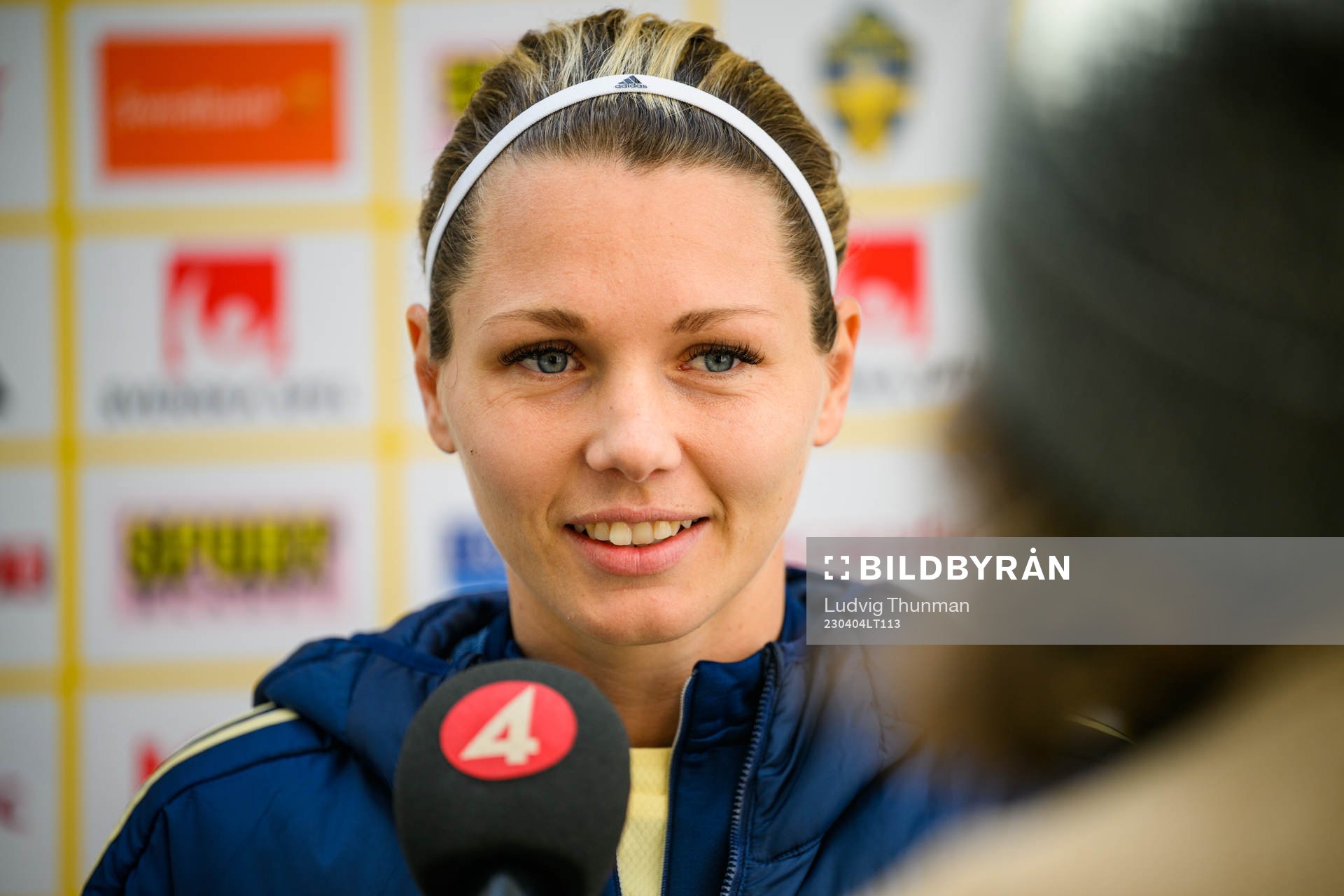 Goalkeeper Jennifer Falk is interviewed by the media