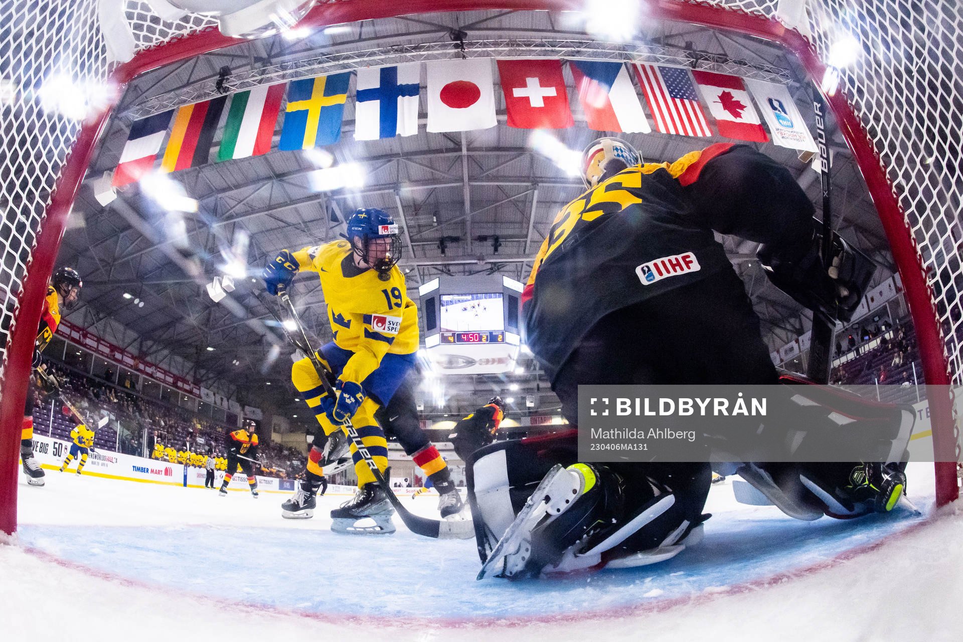 Sara Hjalmarsson of Sweden  and goaltender Sandra