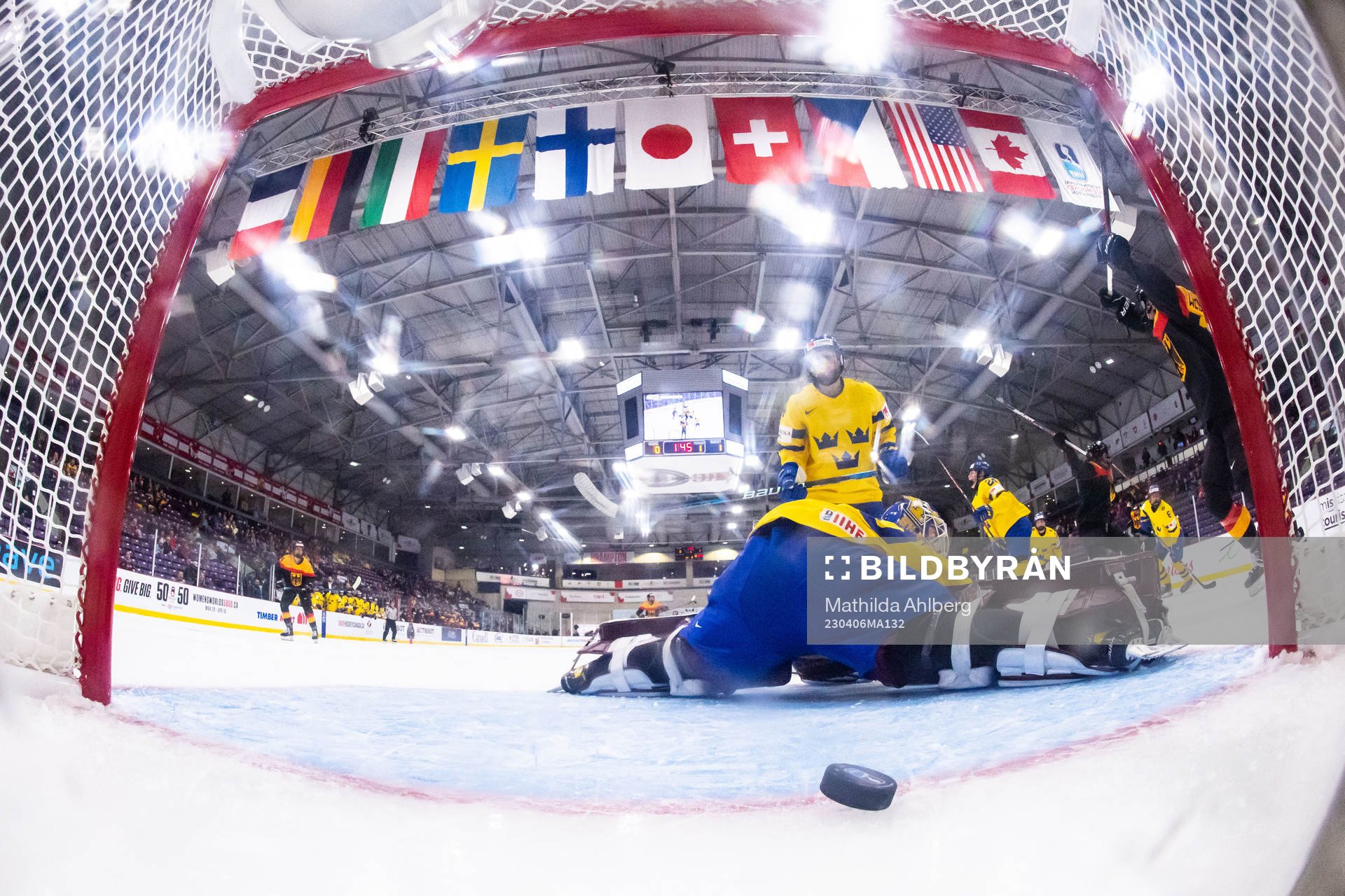 Franziska Feldmeier of Germany scores 1-1 behind goaltender