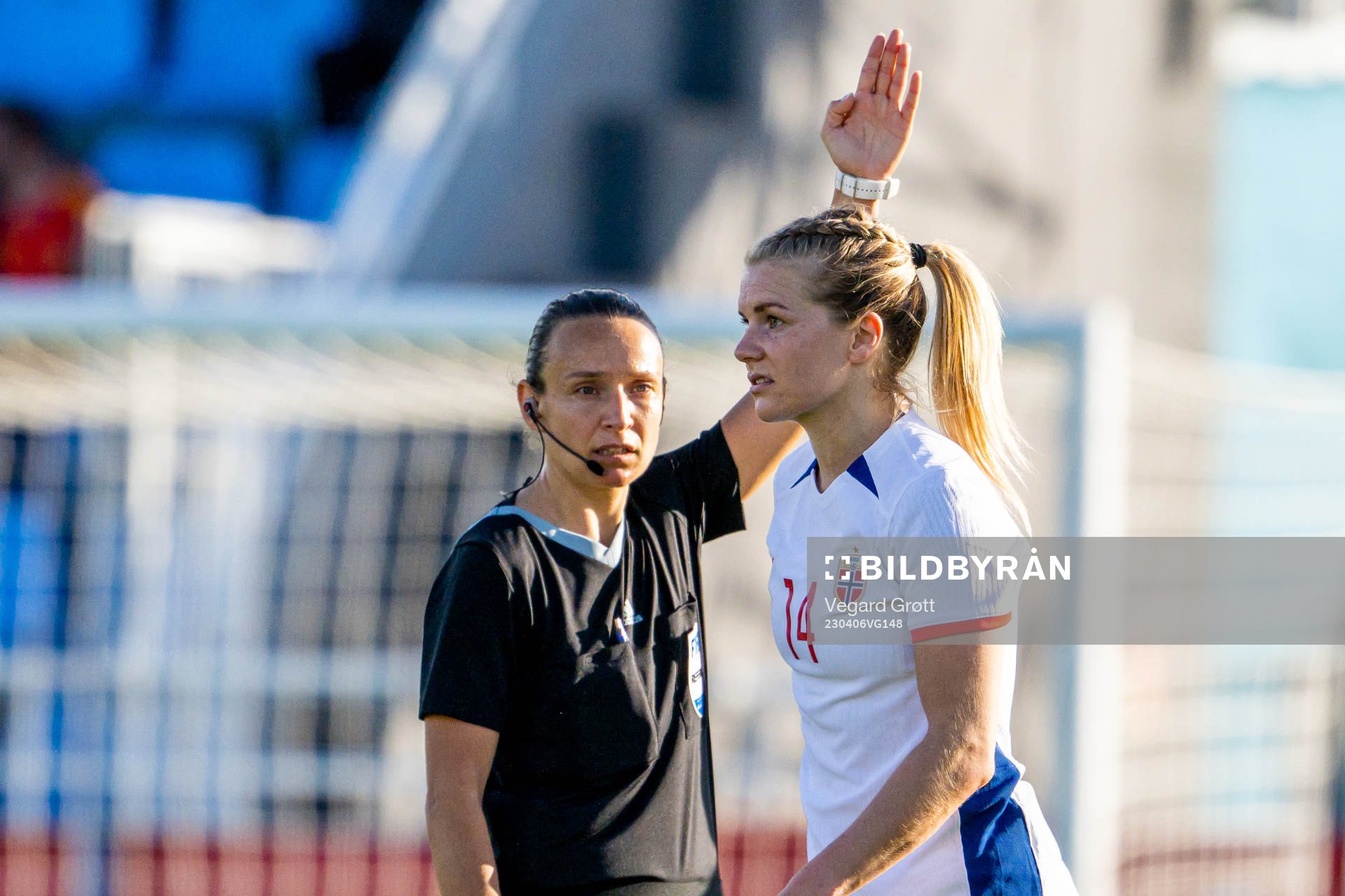 Referee Ivana Projkovska and Ada Hegerberg of Norway