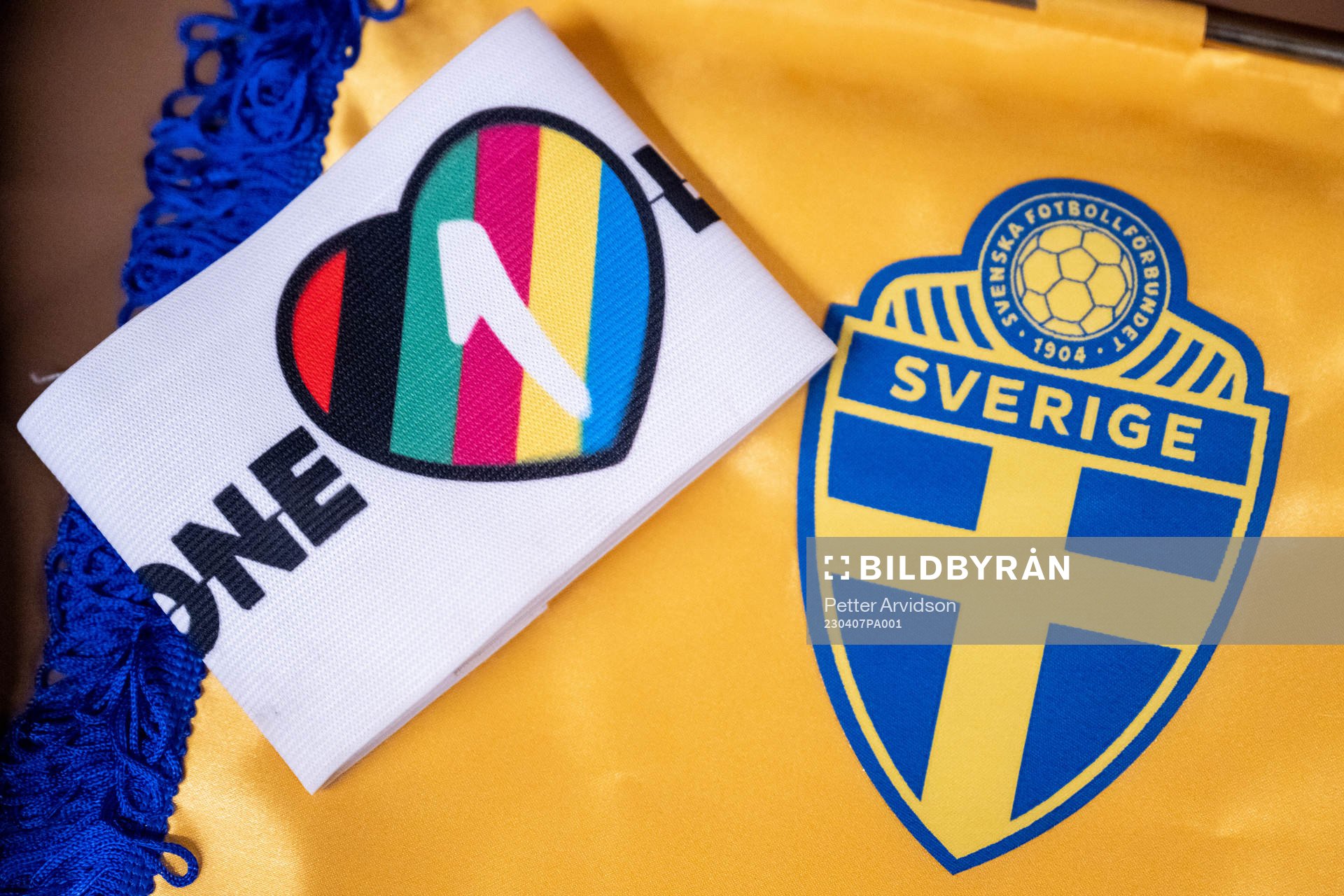 The One Love captains’ armband next to the logo of the