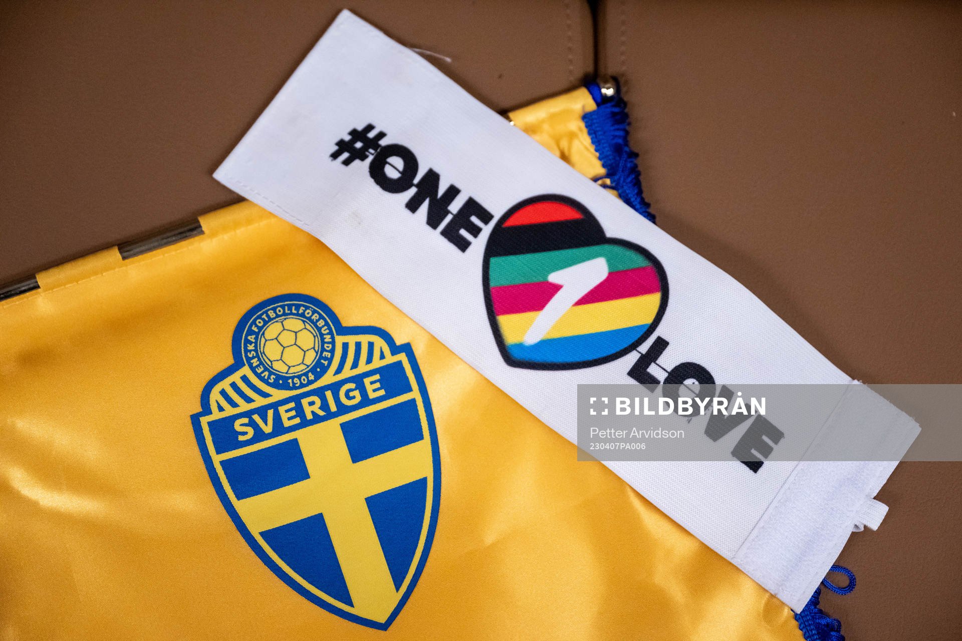 The One Love captains’ armband next to the logo of the
