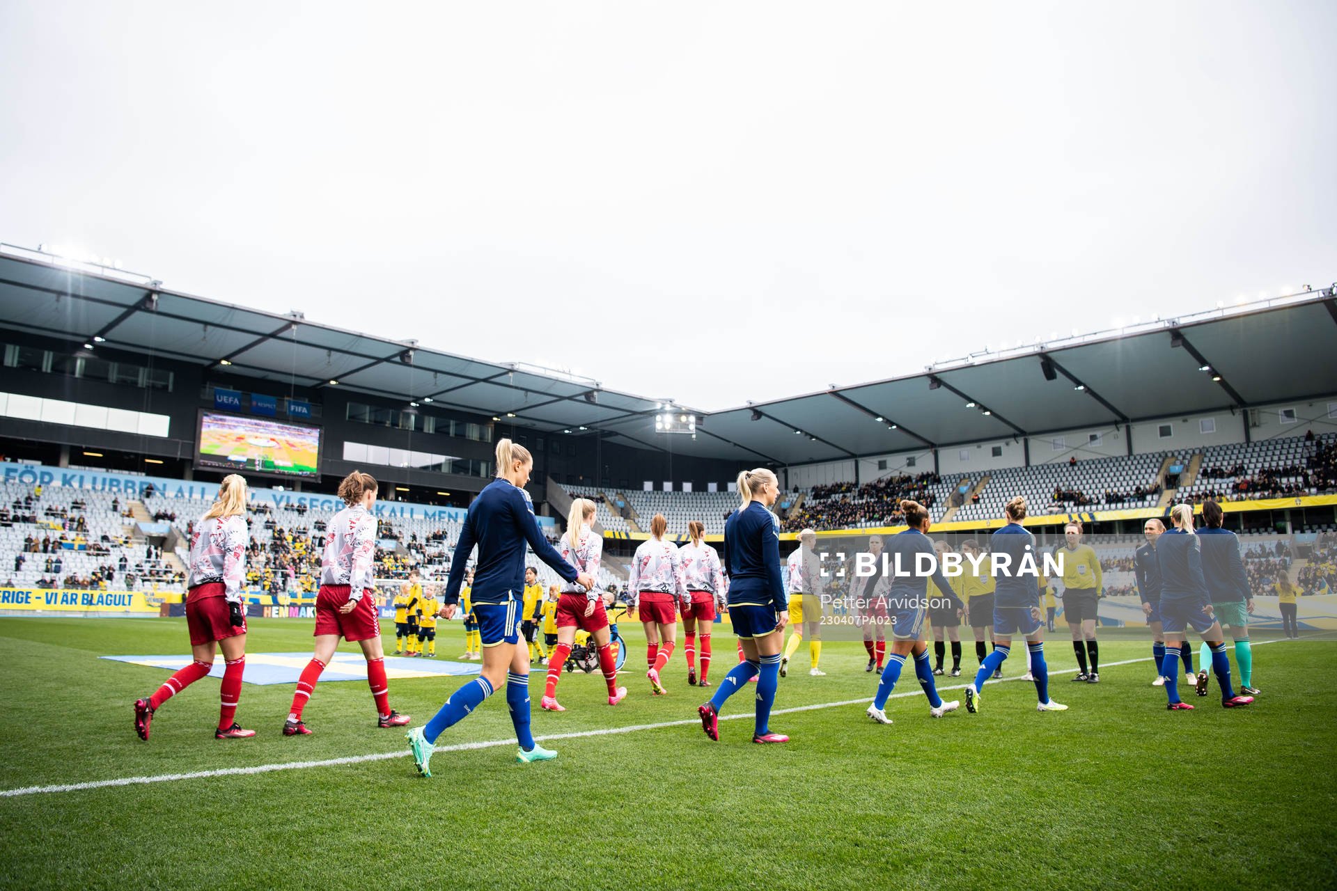 The players of Denmark and of Sweden enter the pitch