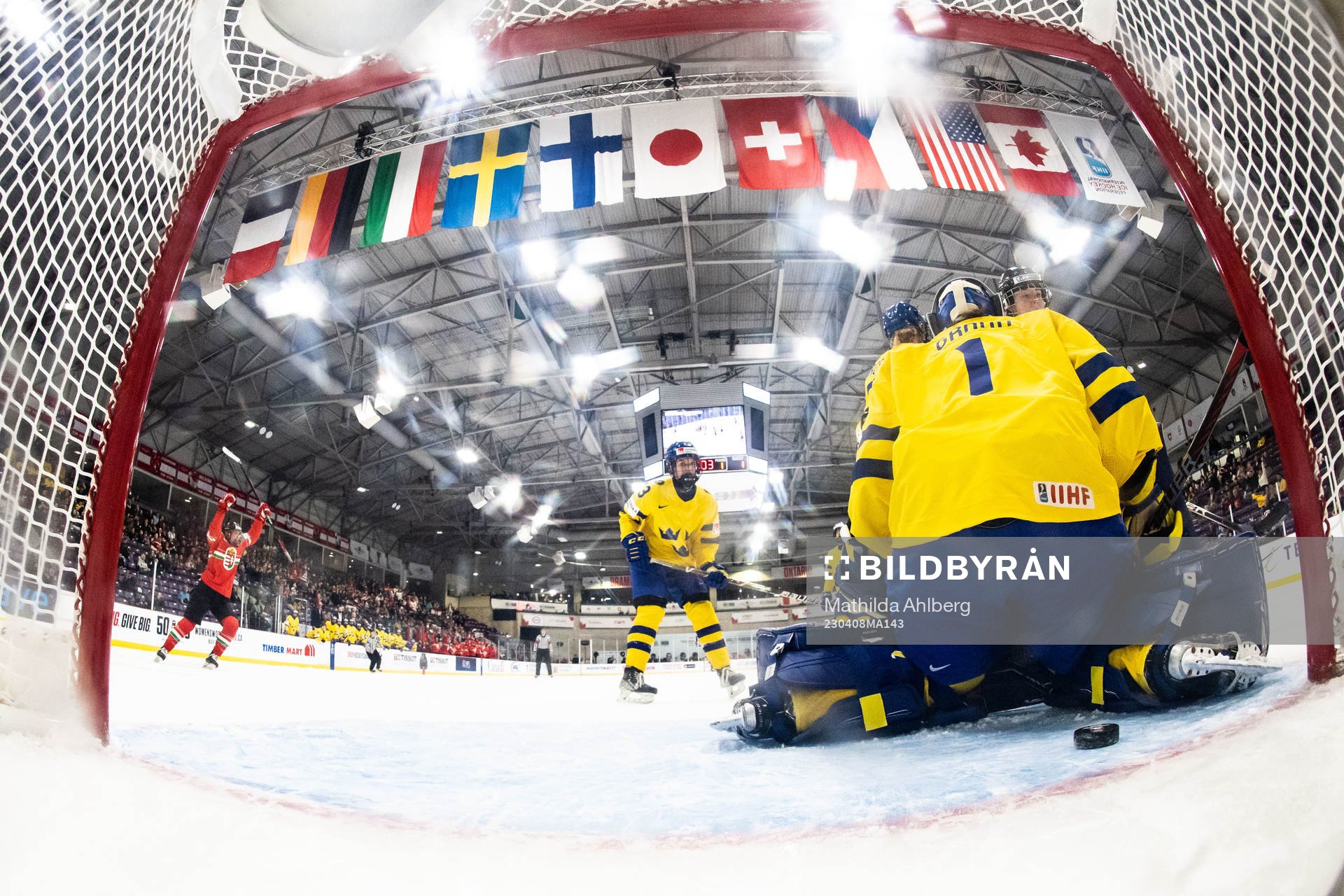 Alexandra Huszak of Hungary scores 2-2 behind goaltender