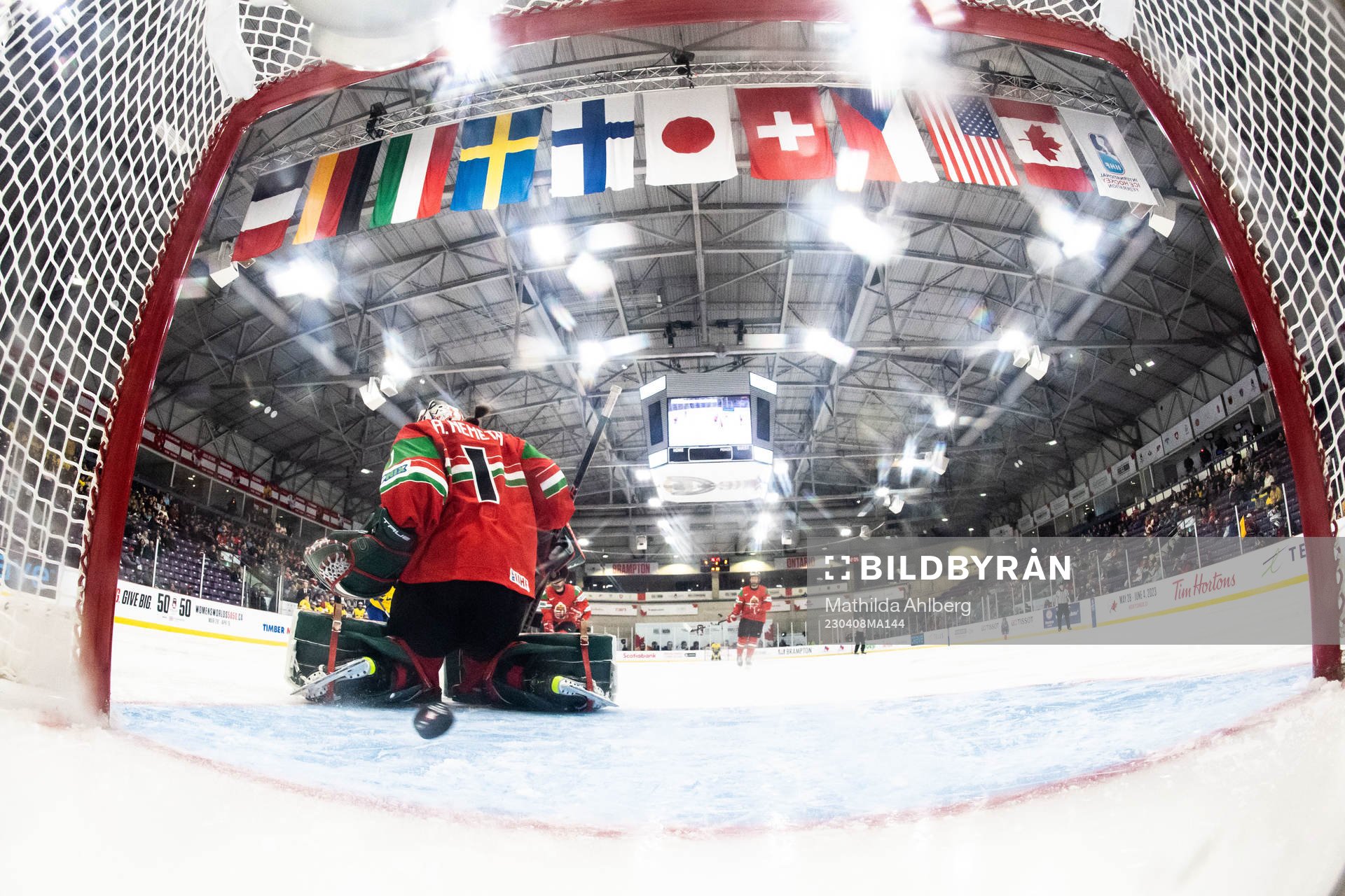 Lina Ljungblom of Sweden scores 5-2 behind goaltender Aniko