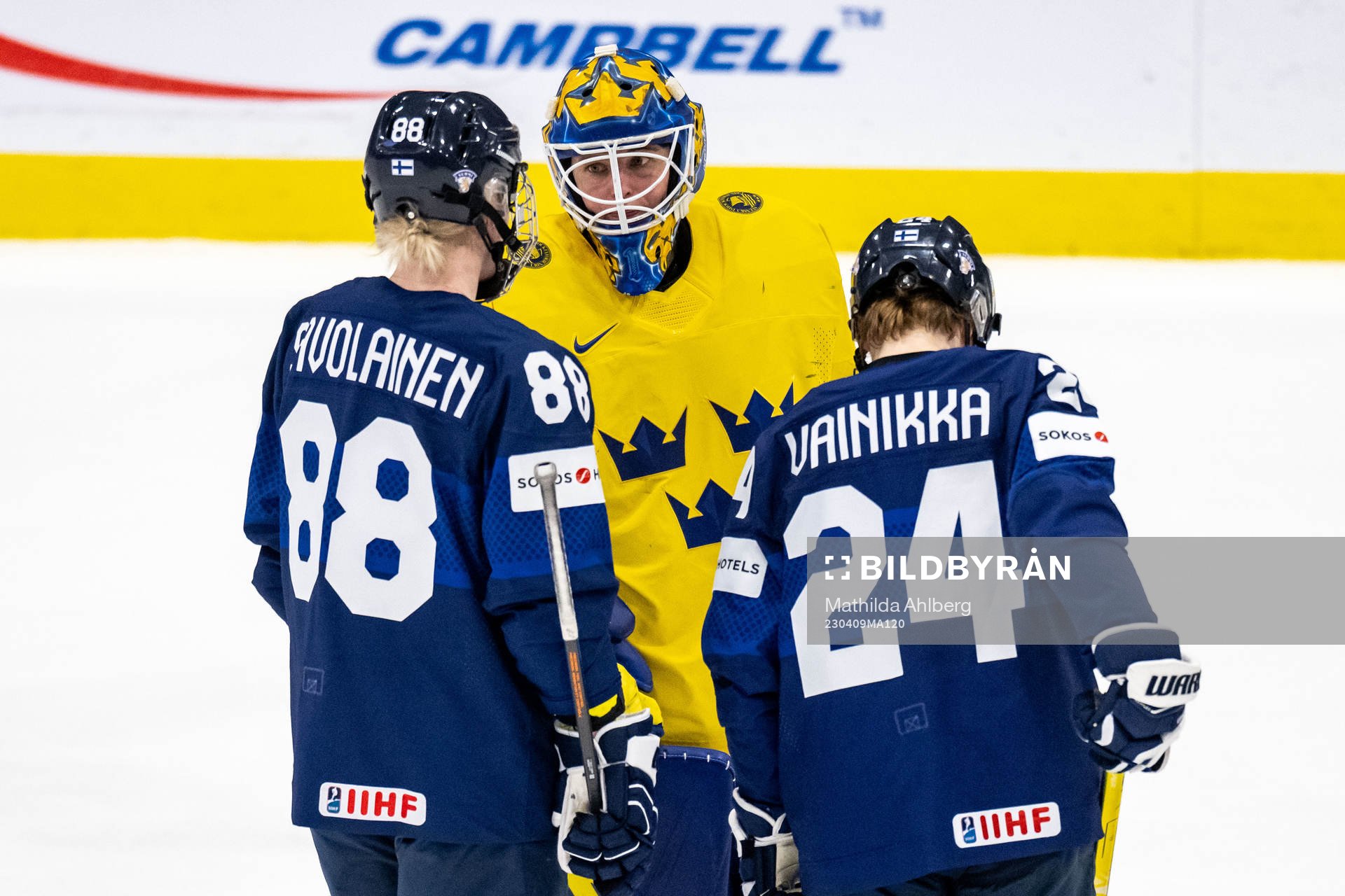 Goaltender Sara Grahn of Sweden and Ronja Savolainen and