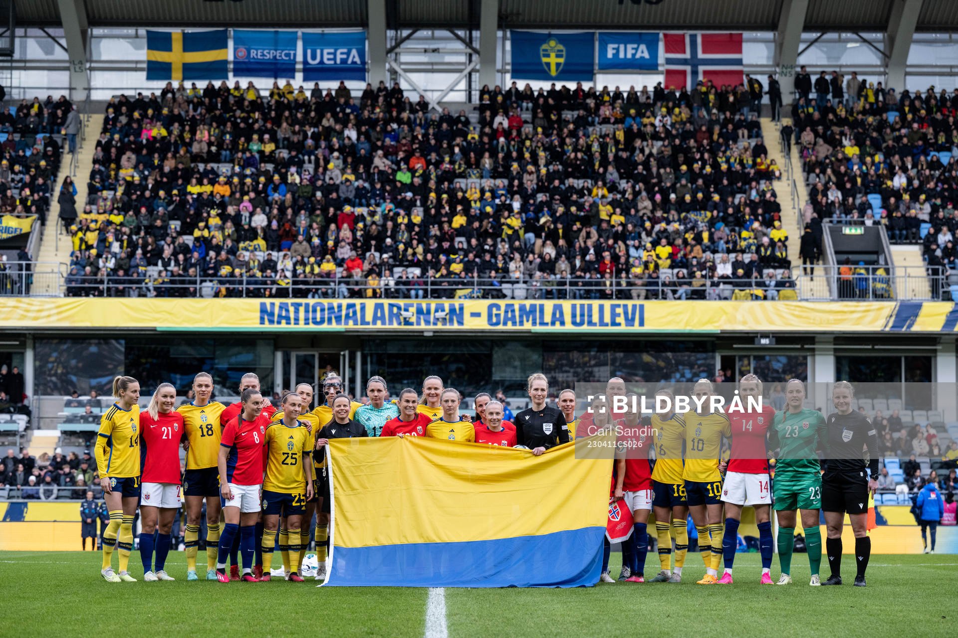 Players of Sweden and of Norway pose for a photo with the
