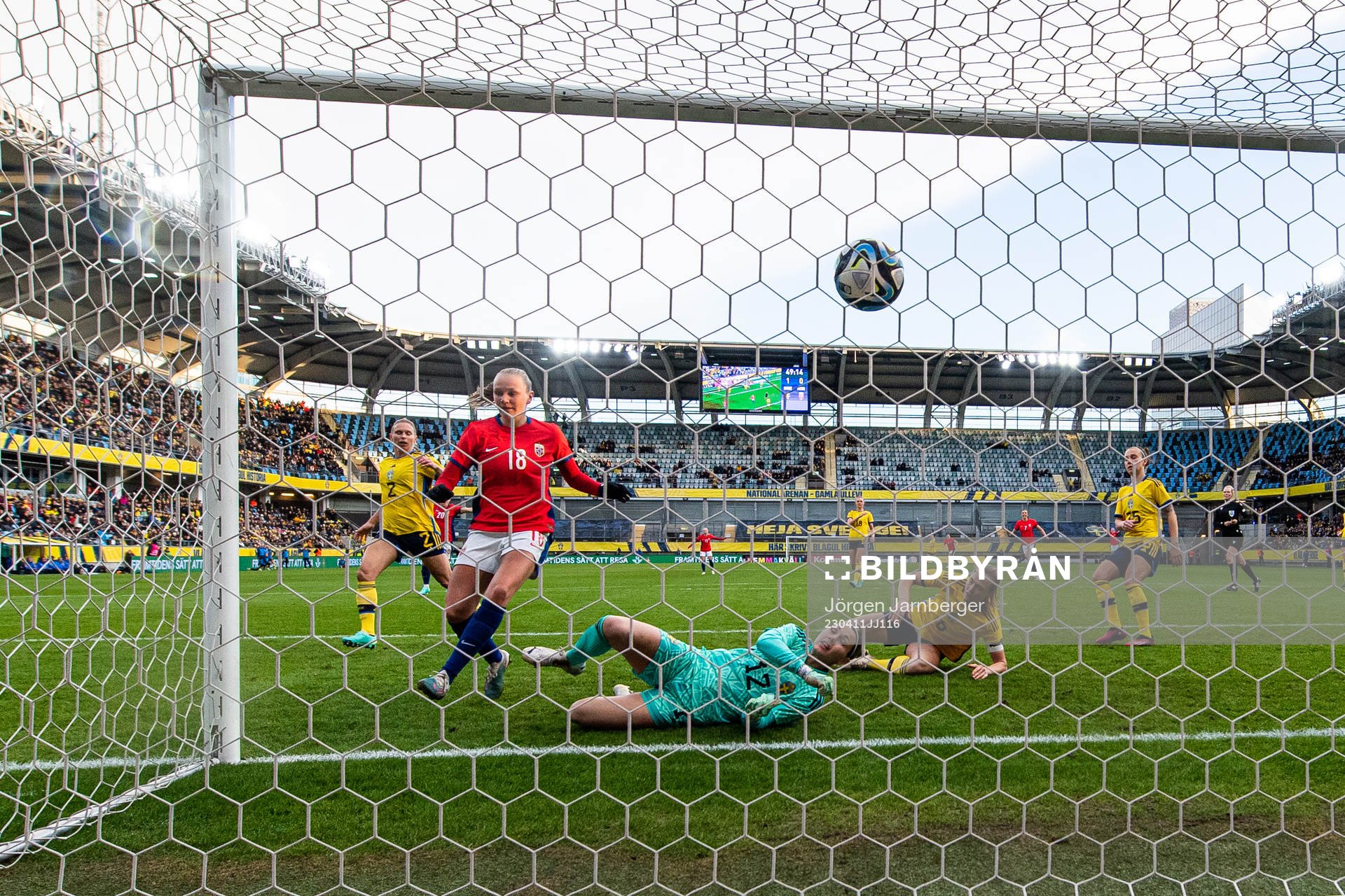 Frida Maanum of Norway score 1-1 behind goalkeeper Jennifer