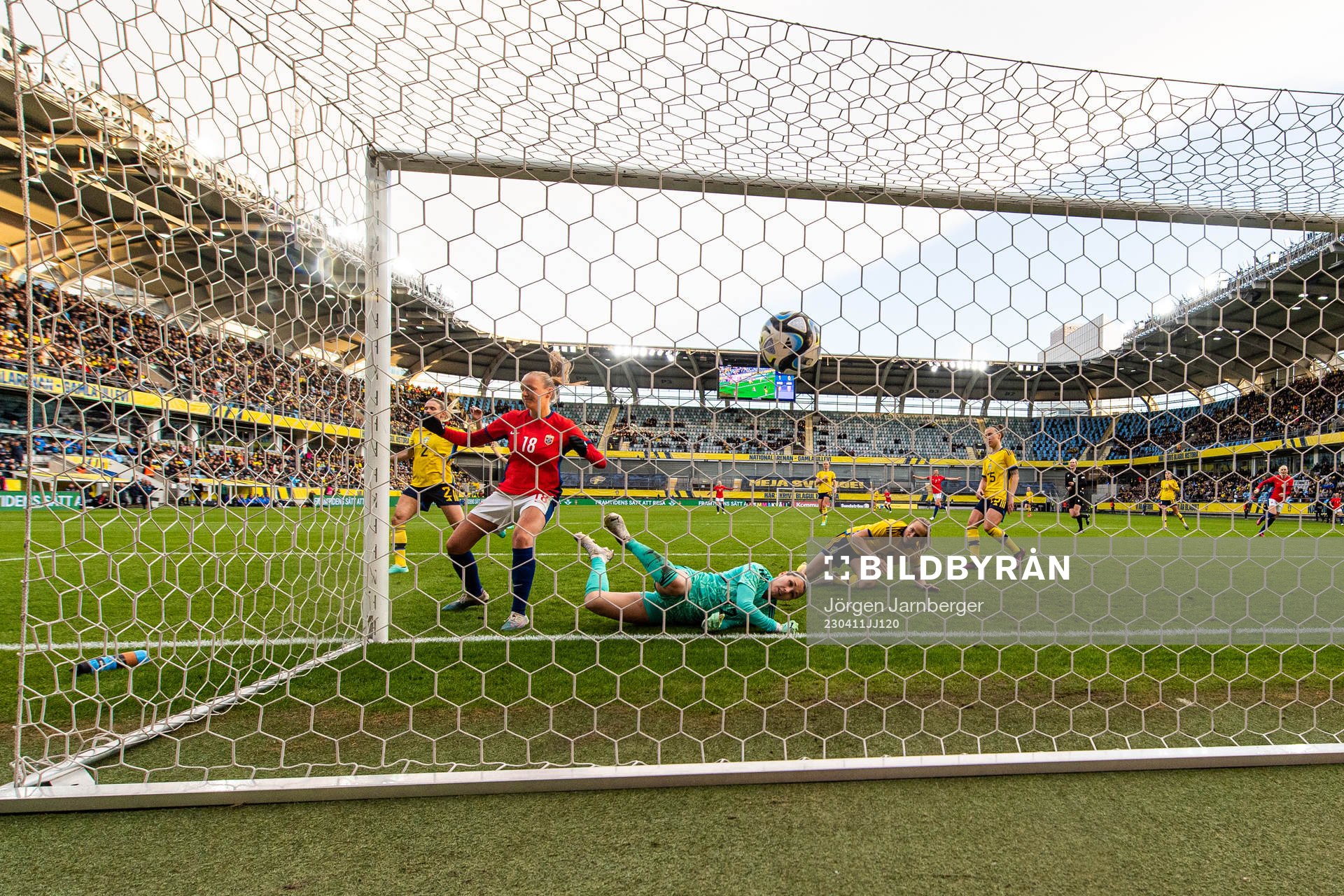 Frida Maanum of Norway score 1-1 behind goalkeeper Jennifer