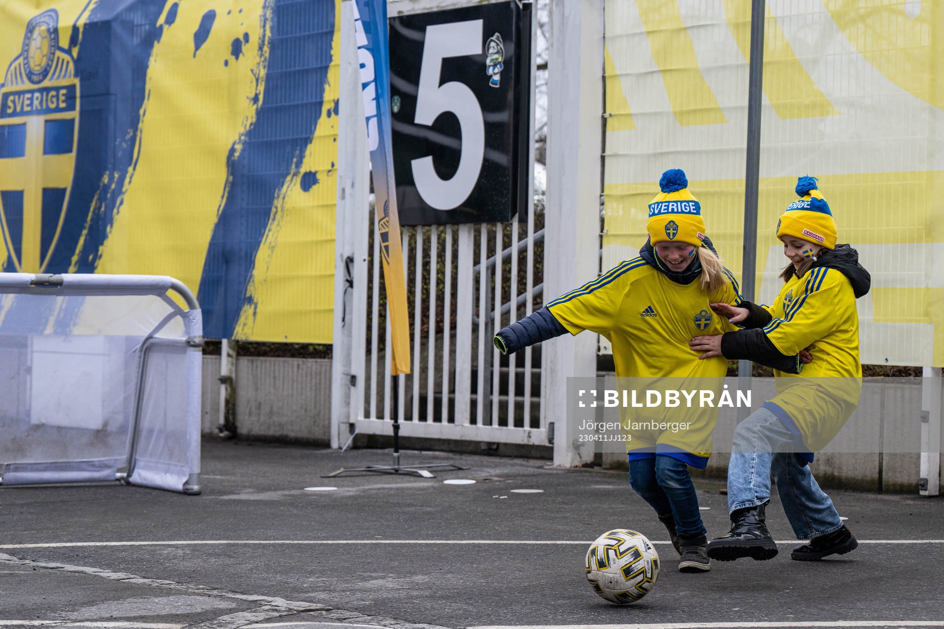 Kids playing football in fan zone