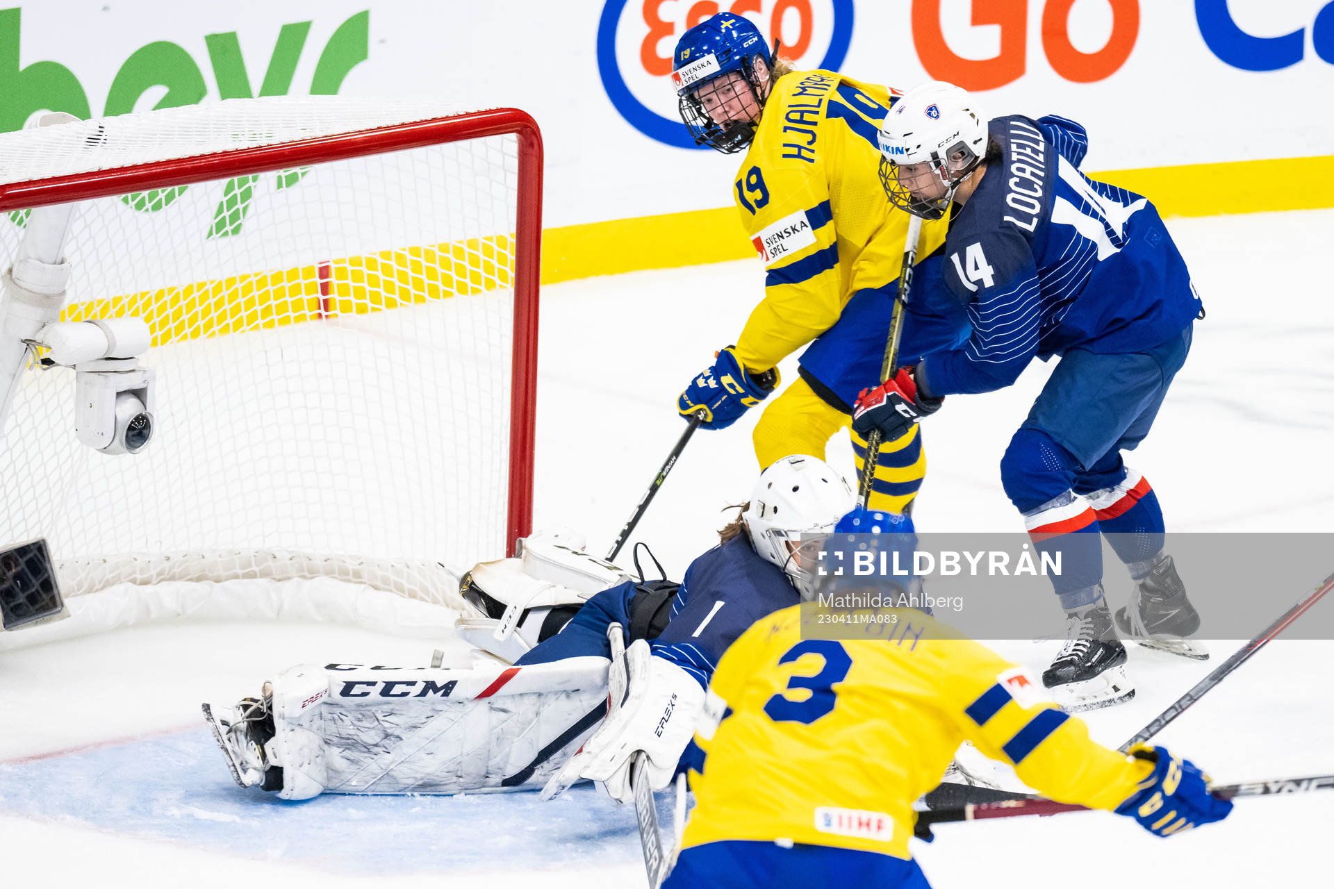 Sara Hjalmarsson of Sweden and goaltender Caroline Lambert