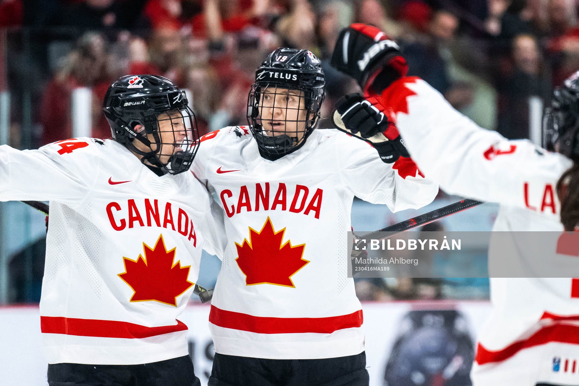 Renata Fast and Brianne Jenner of Canada celebrate scoring