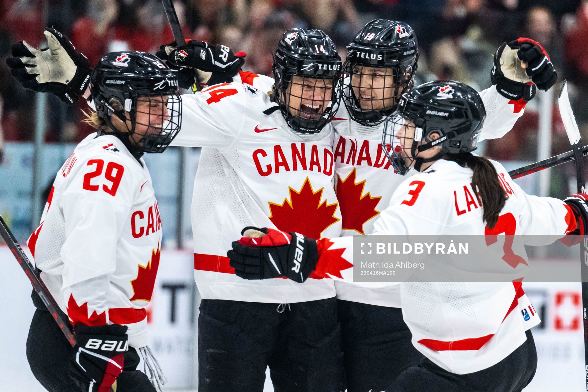 Renata Fast and Brianne Jenner of Canada celebrate scoring